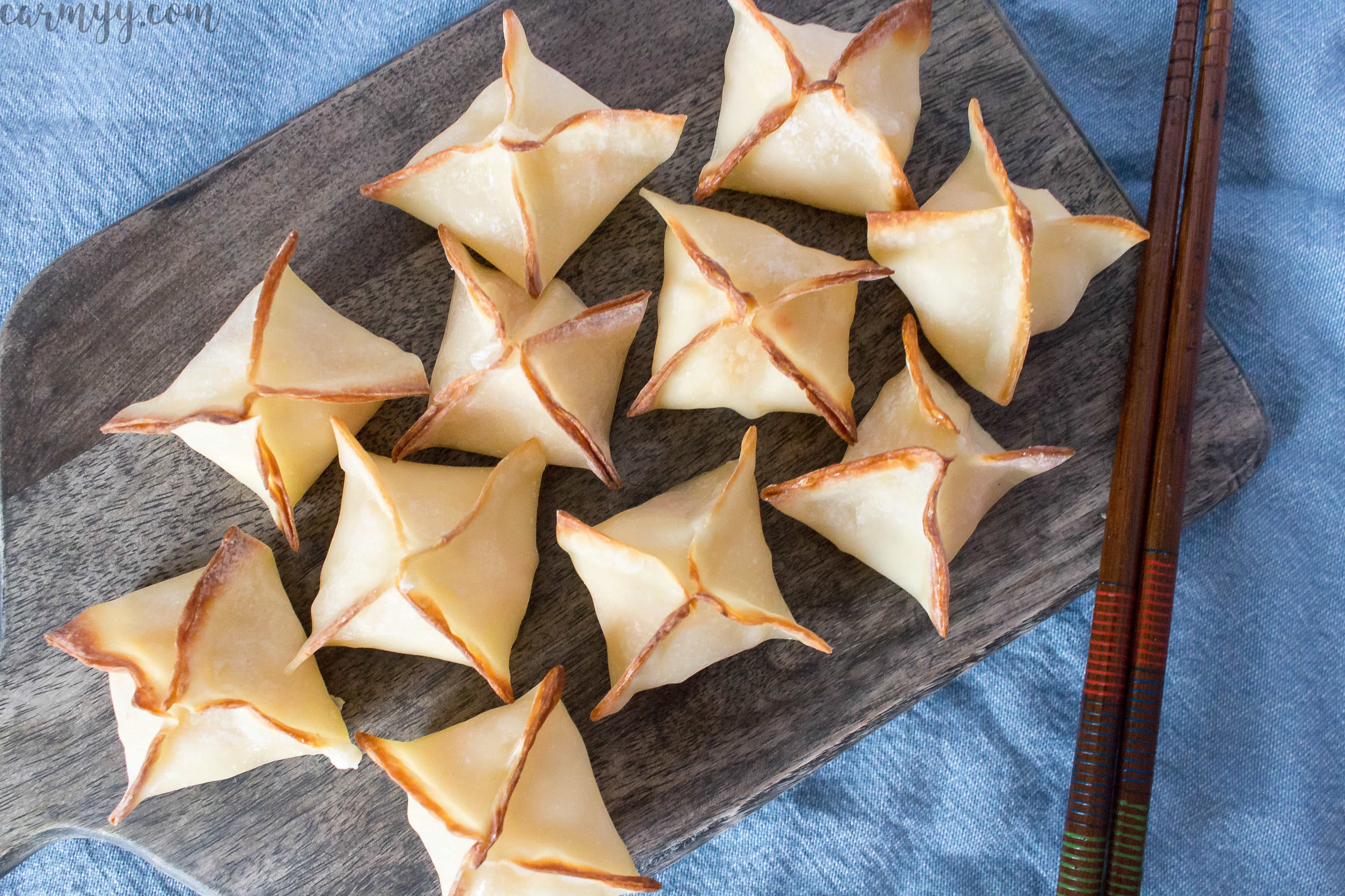 These baked cheesy shrimp wontons are easy to make and are the perfect crowd pleaser for parties or get togethers. Inspired by the deep fried shrimp wontons from sushi restaurants, this is a healthier version made by baking instead.