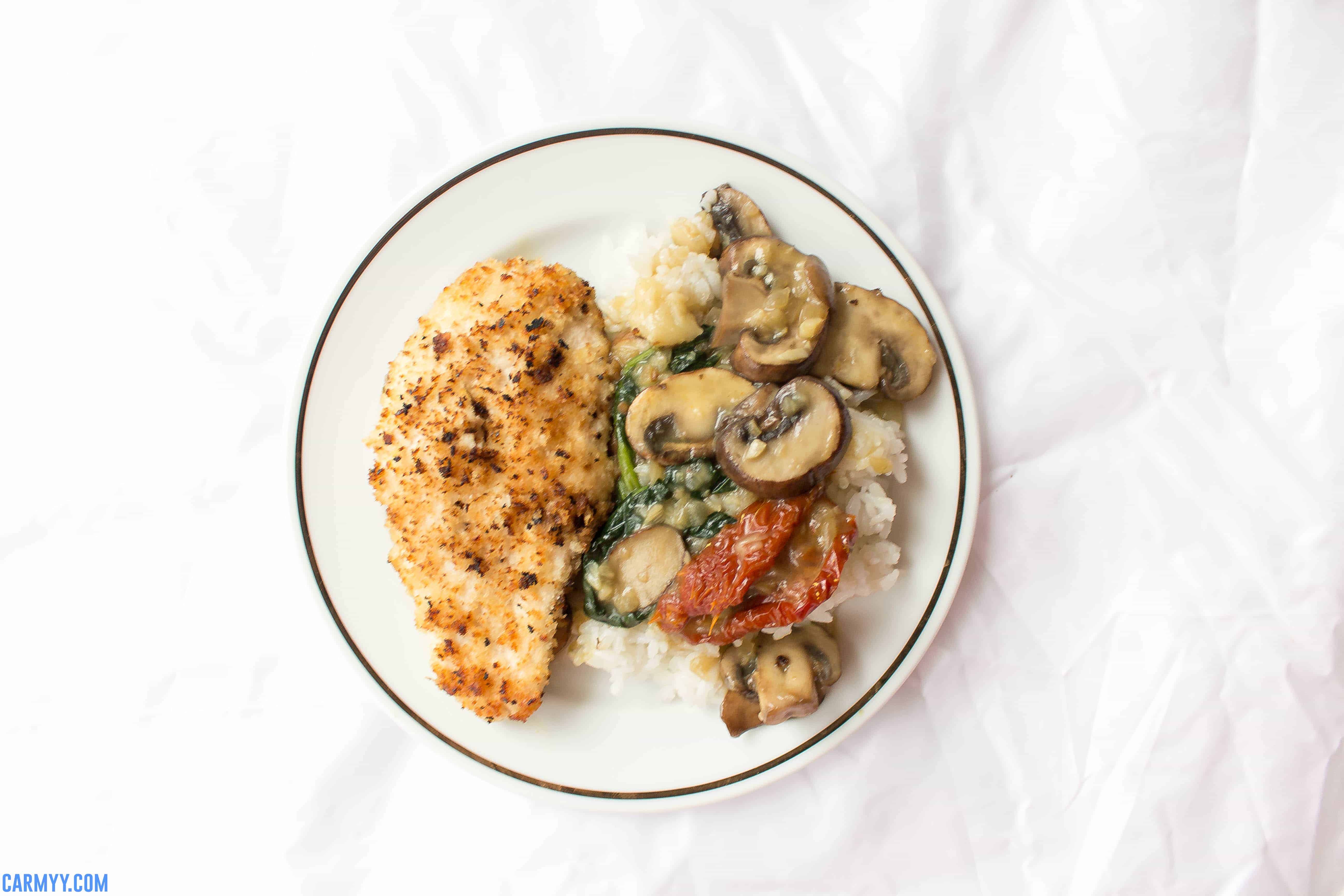 This creamy one pot chicken is made with no cream and packed with flavour! Made with a base of mushroom, spinach, and sun dried tomato, this creamy one pot chicken is the perfect recipe for a lazy dinner under an hour.