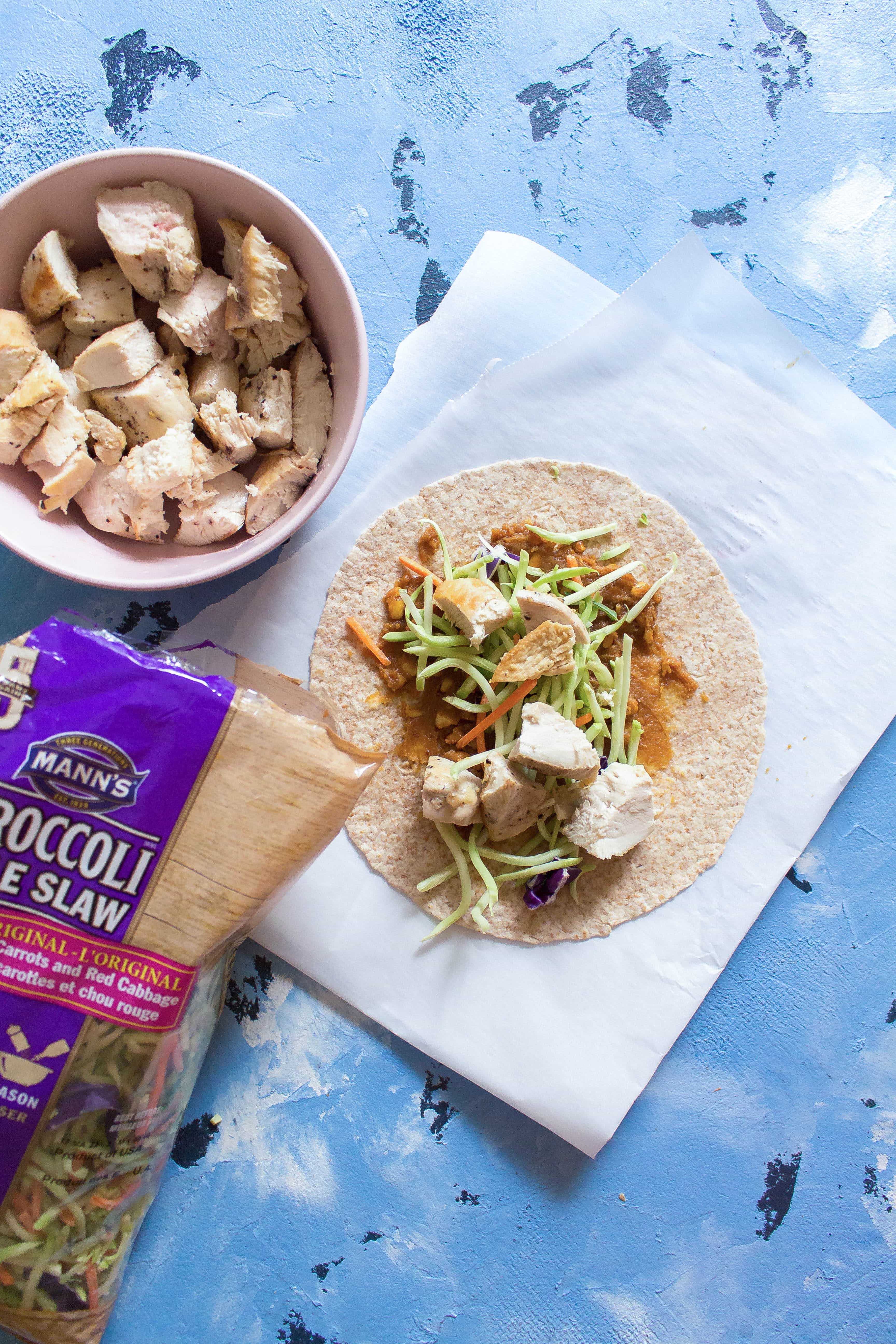  chicken wrap recipes for lunch are the perfect item to bring to work or school. simple healthy wraps for lunch with spicy peanut slaw.