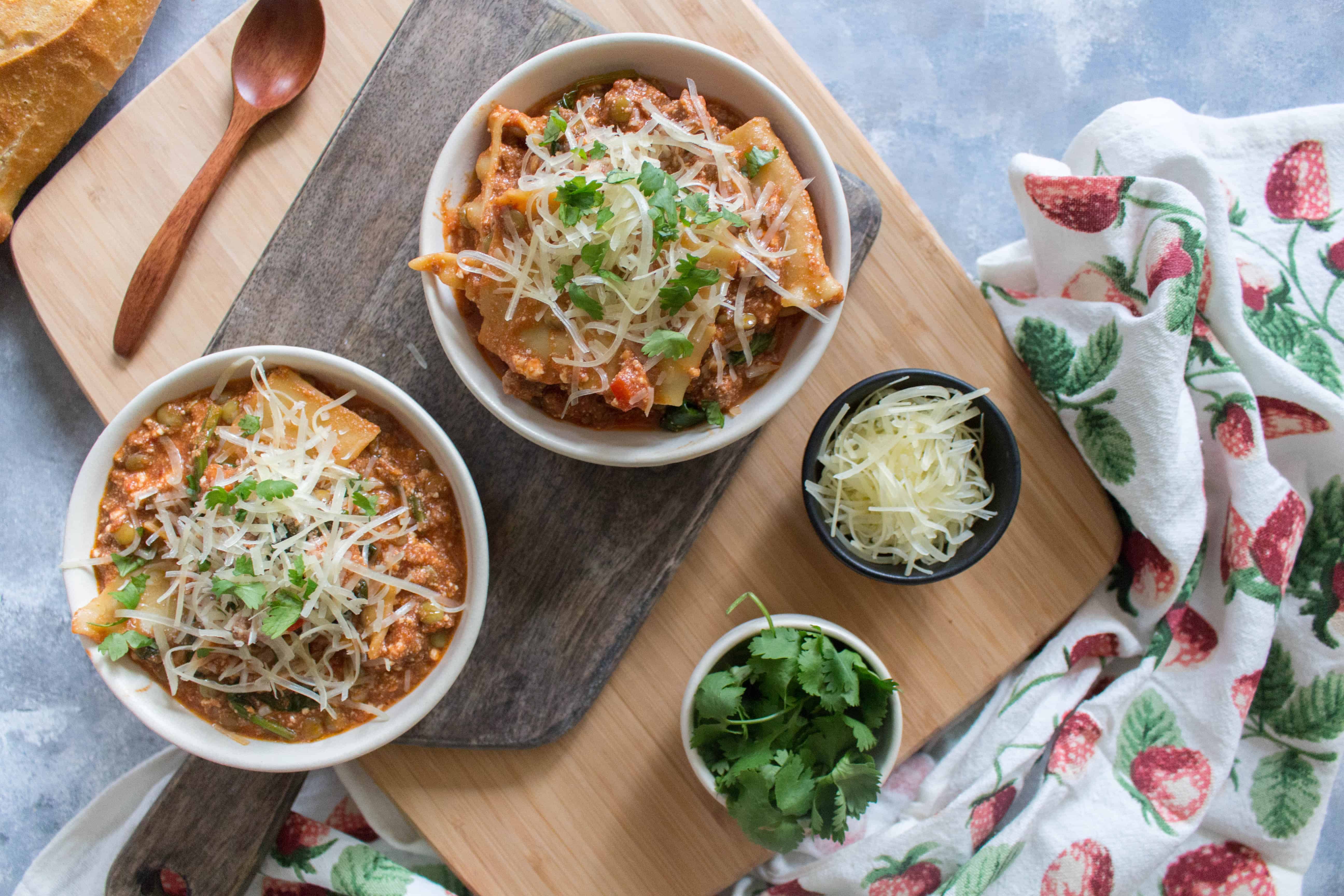 This super easy and Healthy Instant Pot Lasagna Soup will have you grabbing seconds! This lasagna soup is  so comforting and delicious - plus it's filled with extra vegetables! This healthy instant pot lasagna soup will take you under an hour with an Instant Pot! #InstantPot #InstantPotRecipes