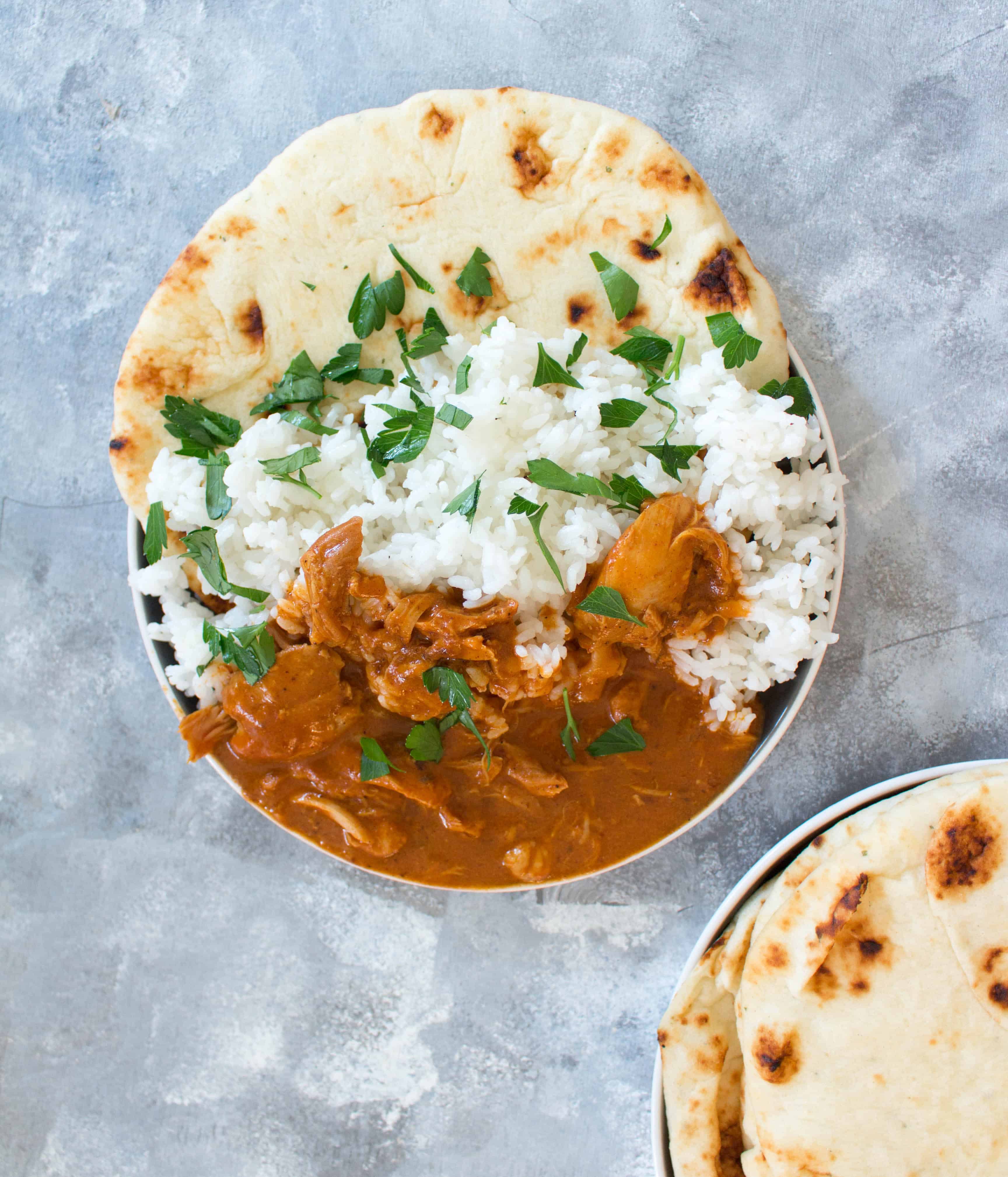 This Healthy Instant Pot Butter Chicken is a lightened up version that takes less than 30 minutes to make and is still rich and creamy. #InstantPotRecipes #InstantPot #ButterChicken #ChickenRecipes