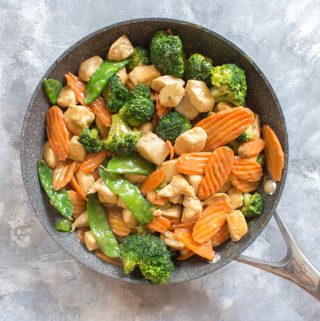 Craving a delicious satay stir fry from your local take out place? Skip the take out and make your own healthy chicken and vegetable stir fry with peanut sauce. It takes less than 30 minutes and you can pack the leftovers as a work lunch!