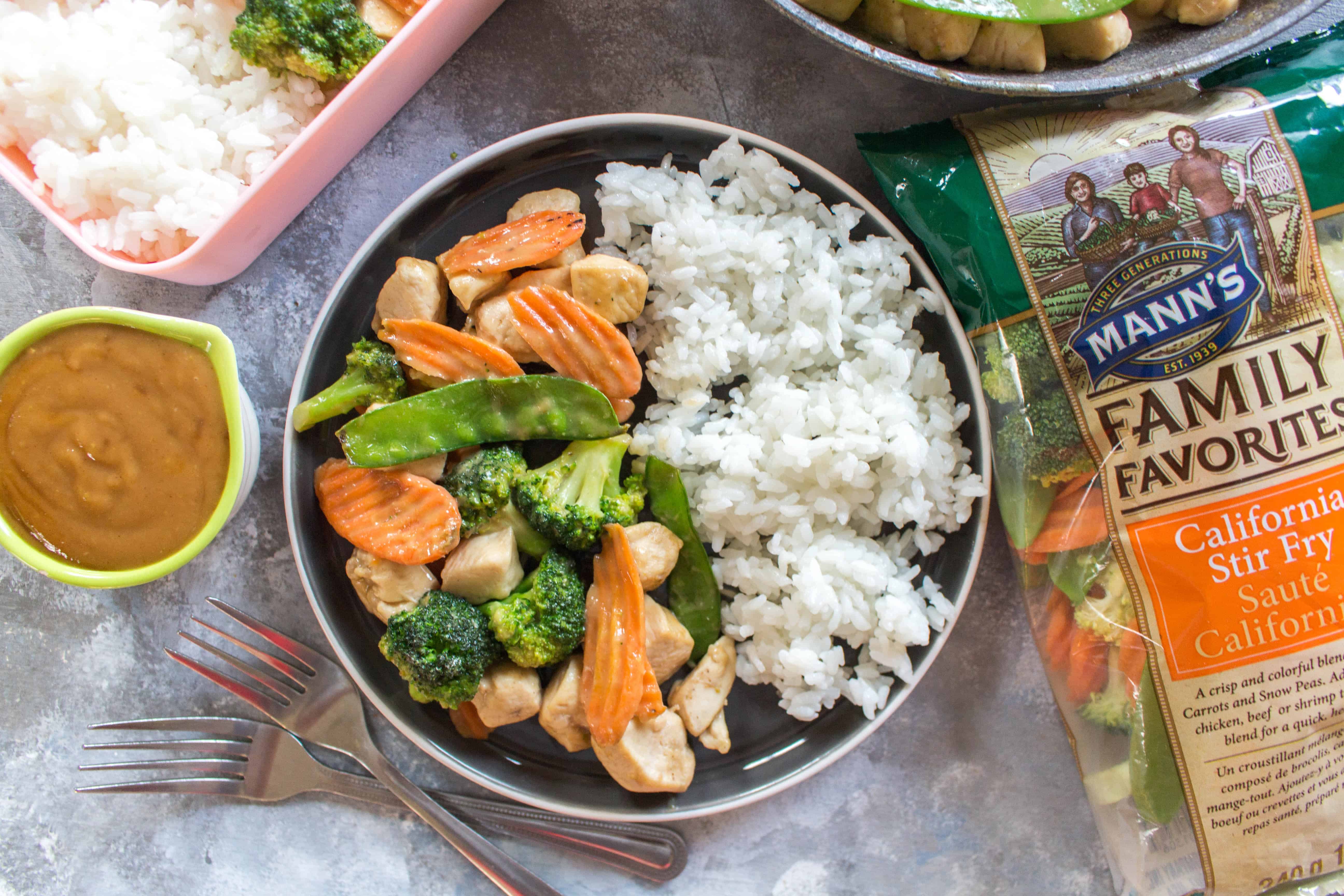 Craving a delicious satay stir fry from your local take out place? Skip the take out and make your own healthy chicken and vegetable stir fry with peanut sauce. It takes less than 30 minutes and you can pack the leftovers as a work lunch!