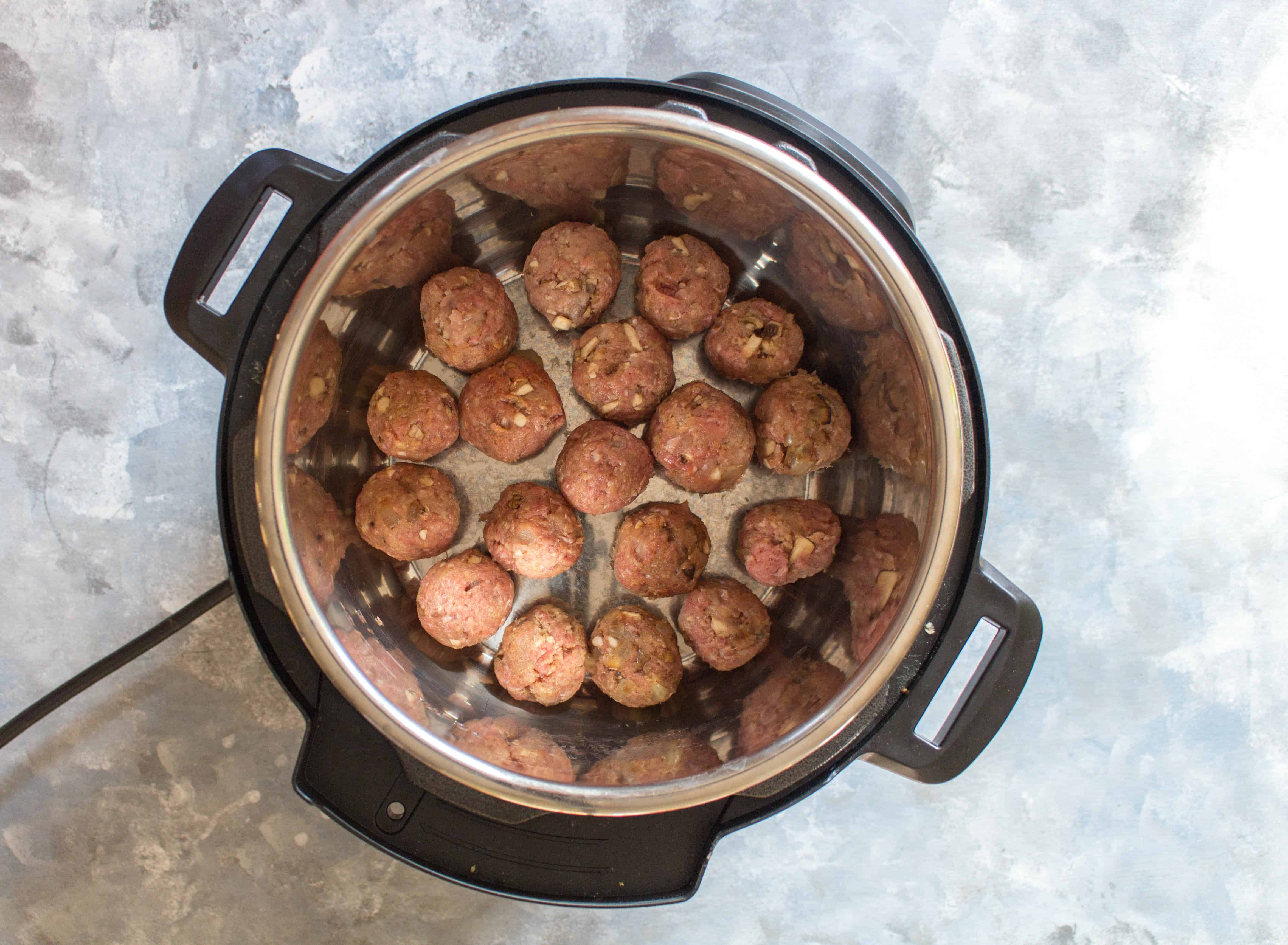 Instant Pot Salisbury Steak Styled Meatballs in the Instant Pot to be browned