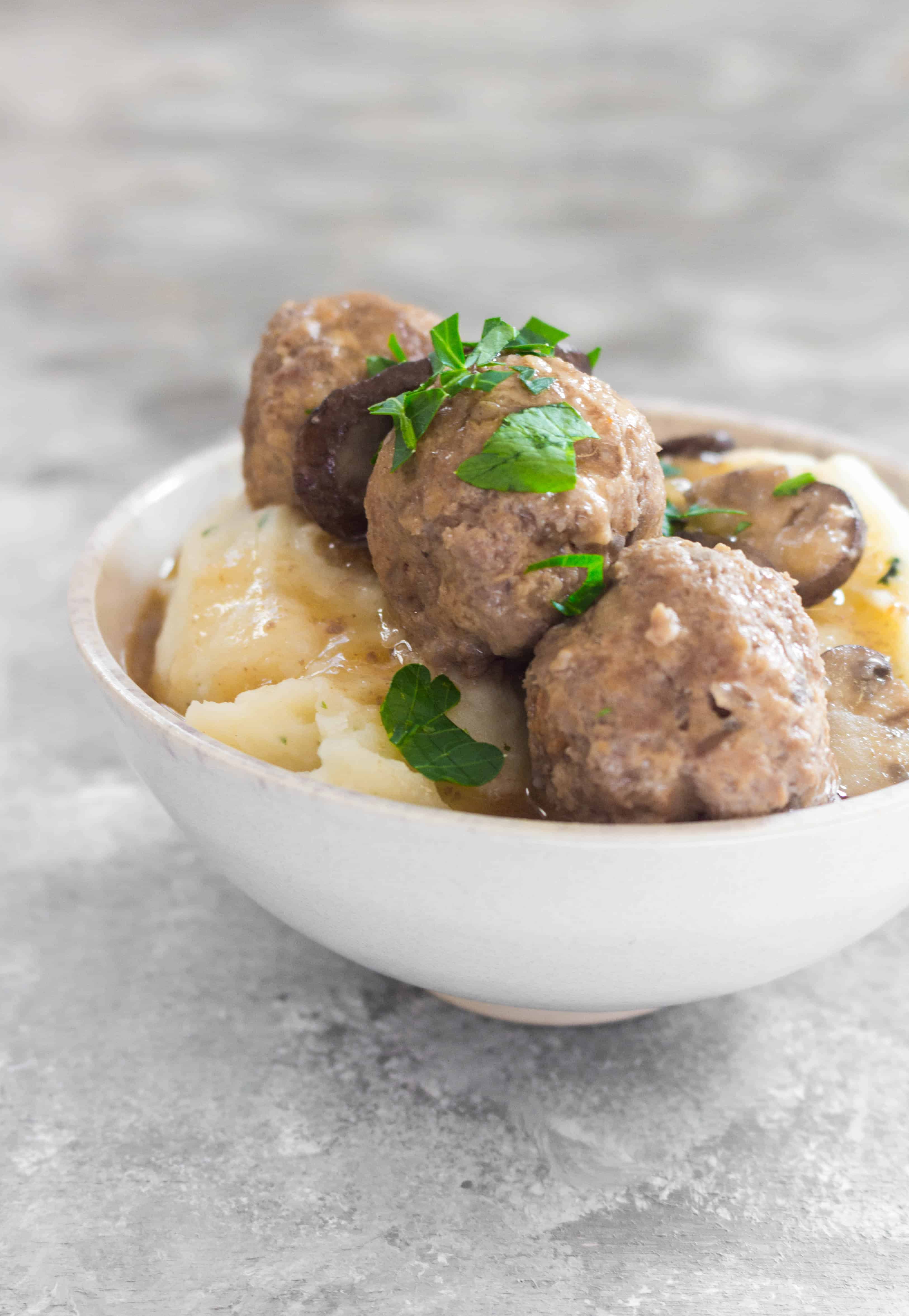 This Instant Pot Salisbury Steak Styled Meatballs Recipe is inspired by the salisbury steak frozen dinners in the frozen food aisle. These yummy salisbury steak meatballs are lightened up by using both turkey meat and beef with mushrooms and take under 30 minutes to make!
