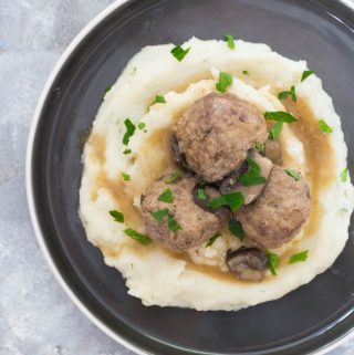 This Instant Pot Salisbury Steak Meatballs Recipe is inspired by the salisbury steak frozen dinners in the frozen food aisle. These yummy salisbury steak meatballs are lightened up by using both turkey meat and beef with mushrooms and take under 30 minutes to make!
