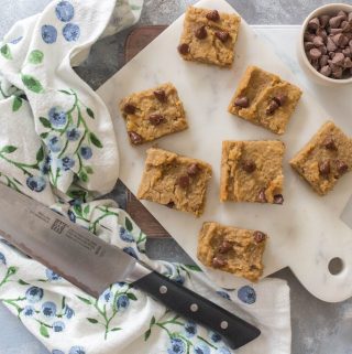 A cross between fudge and brownies, this Flourless Healthy Chickpea Peanut Butter Blondies is a guilt-free treat that takes next to no time to whip up! #healthydesserts #