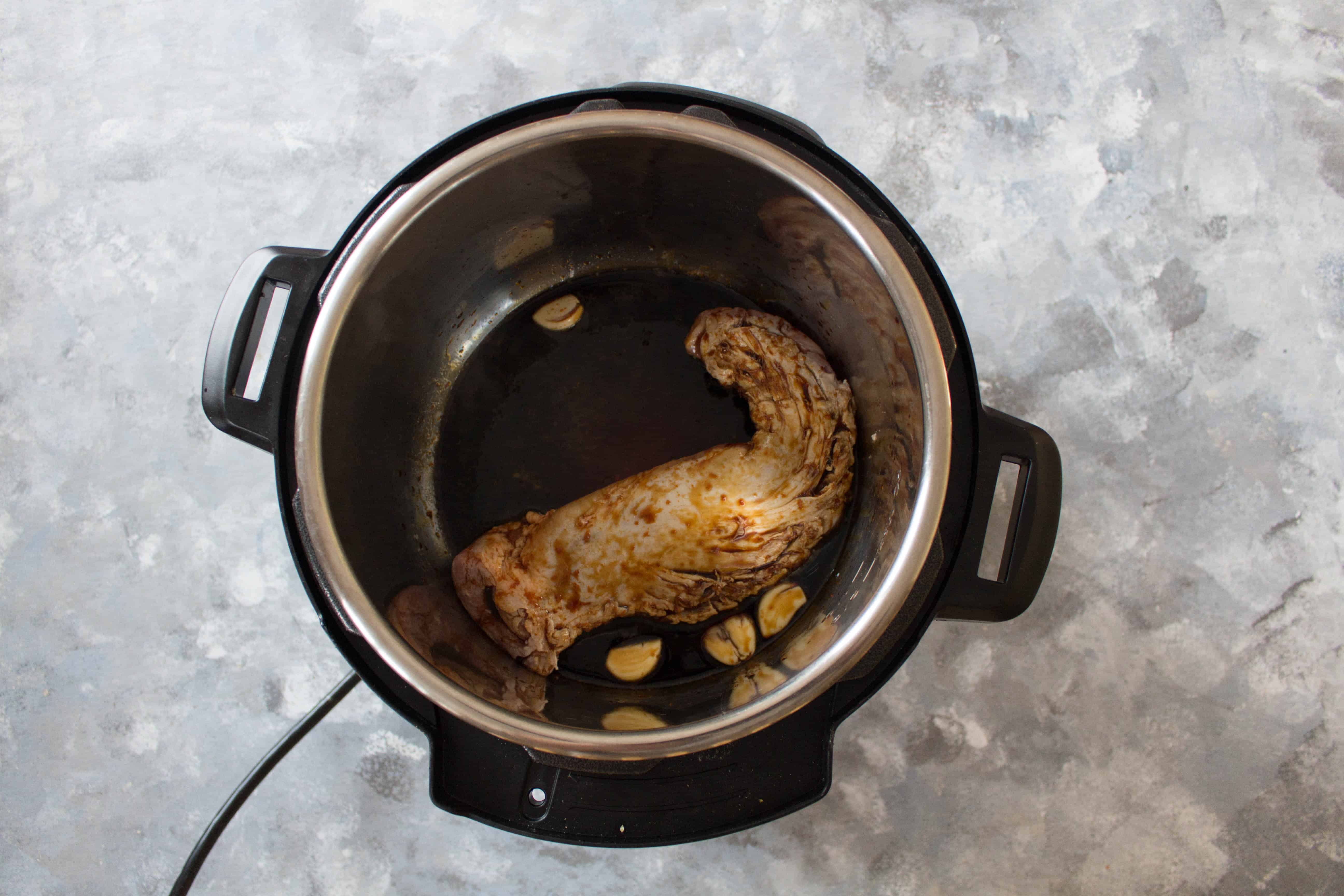 step three, add in the teriyaki sauce to the pork ternderloin in the instant pot