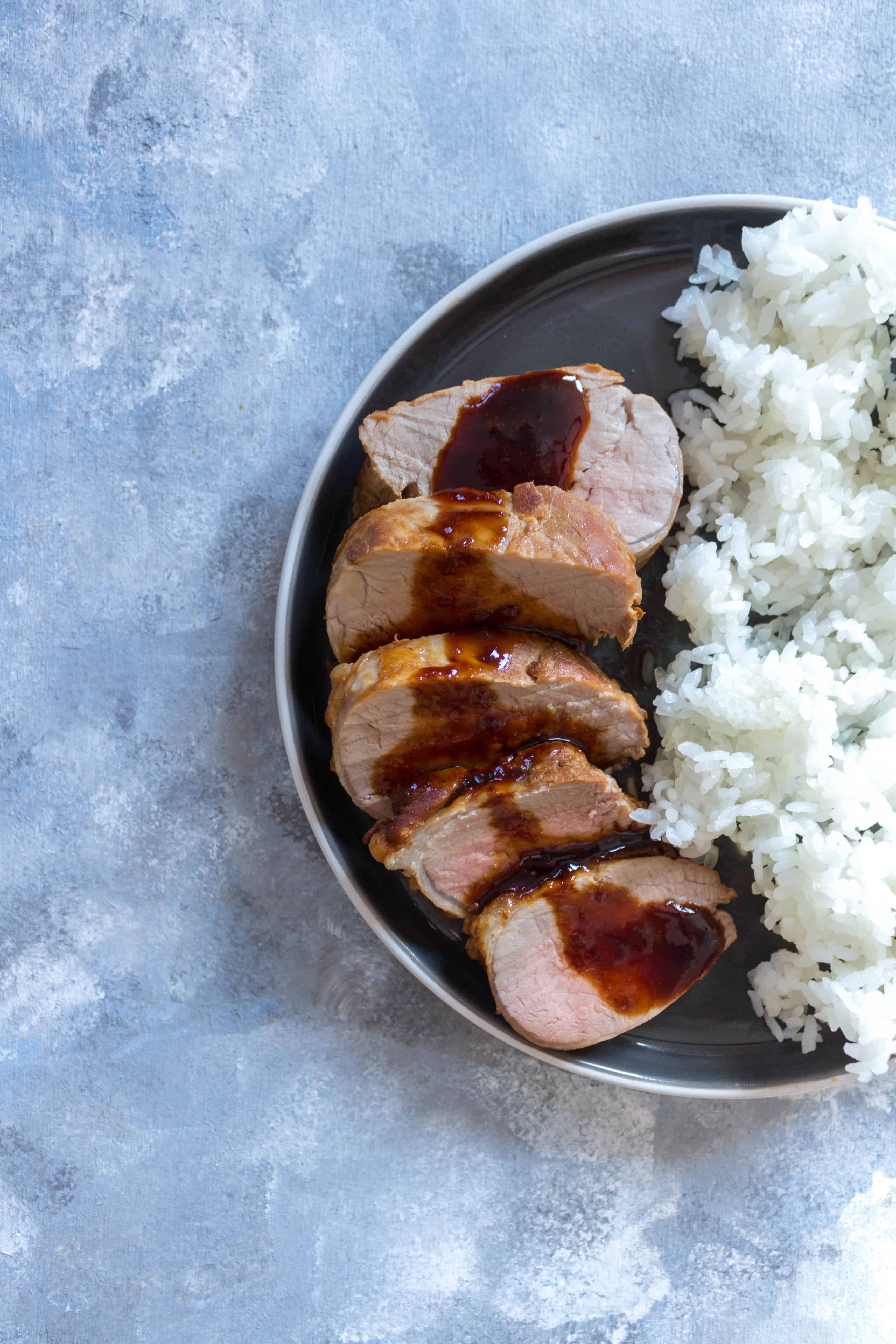 This super easy Instant Pot Teriyaki Pork Tenderloin only takes 7 minutes! This pork tenderloin is tender and coated in a delicious teriyaki sauce that is made inside the Instant Pot too! (Stovetop + Oven instructions at the bottom too if you don't have an IP) #InstantPot #InstantPotRecipe #PorkTenderloinRecipe #TeriyakiRecipe #TeriyakiSauce