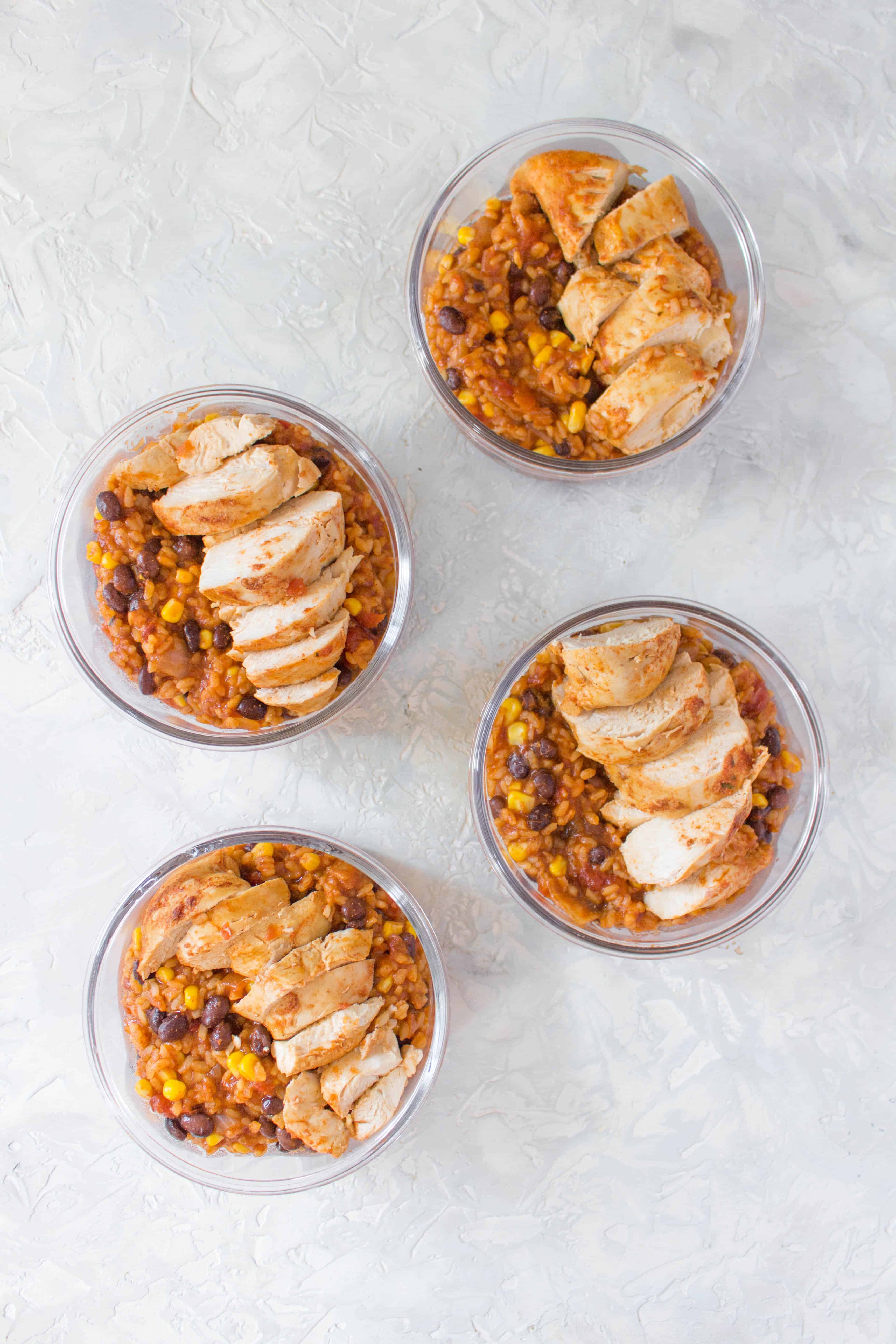 This Spicy Instant Pot Chicken and Rice Meal Prep is inspired by the chicken burrito bowls from Chipotle! It's so easy to make and takes less than 30 minutes to meal prep for four days!