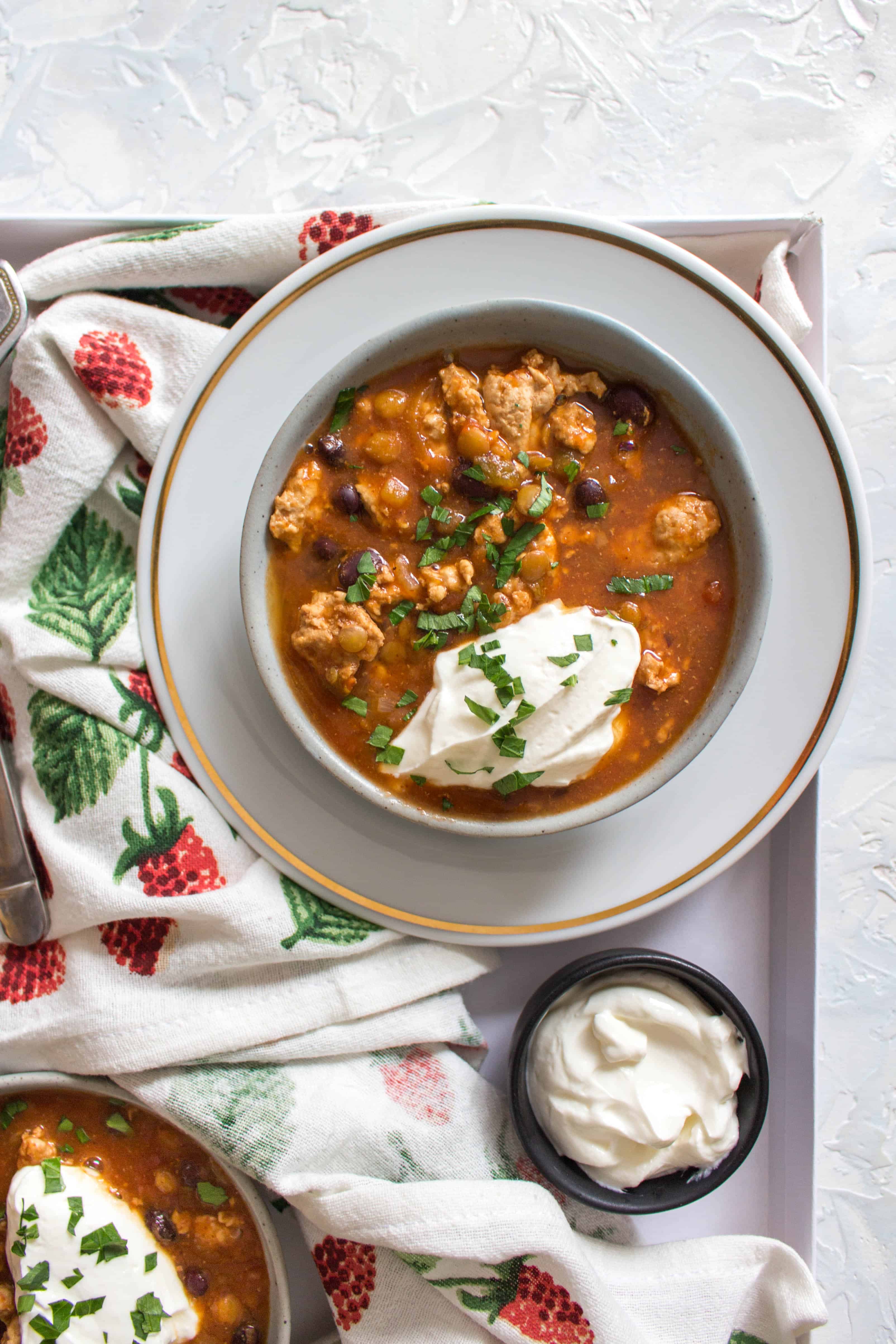 This Healthy Instant Pot Turkey and Lentil Chili Recipe is the perfect meal for any night of the week! The turkey keeps the calories low and the extra boost of lentils in the chili helps keeps you feeling full.