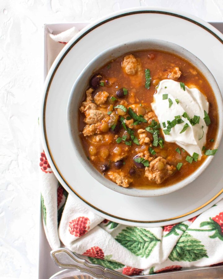 This Healthy Instant Pot Turkey and Lentil Chili Recipe is the perfect meal for any night of the week! The turkey keeps the calories low and the extra boost of lentils in the chili helps keeps you feeling full.