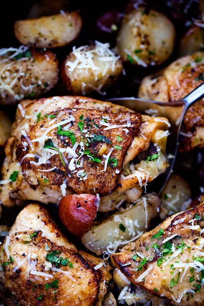 Slow Cooker Parmesan Garlic Herb Chicken is such an easy meal that is packed with amazing flavor! The potatoes cook to tender perfection in garlic, parmesan, and fresh herbs and the chicken is perfectly juicy. 