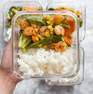 This Sriracha Honey Shrimp Meal Prep is perfect for days where you are craving a stir fry. Made in under 30 minutes, this pan-seared shrimp with veggies mixed in, is the perfect blend of sweet and hot. This Sriracha Honey Shrimp recipe is not only great as a meal prep but perfect as a quick weeknight dinner.