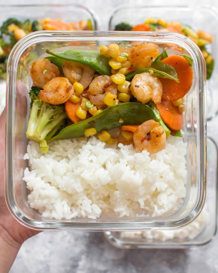This Sriracha Honey Shrimp Meal Prep is perfect for days where you are craving a stir fry. Made in under 30 minutes, this pan-seared shrimp with veggies mixed in, is the perfect blend of sweet and hot. This Sriracha Honey Shrimp recipe is not only great as a meal prep but perfect as a quick weeknight dinner.