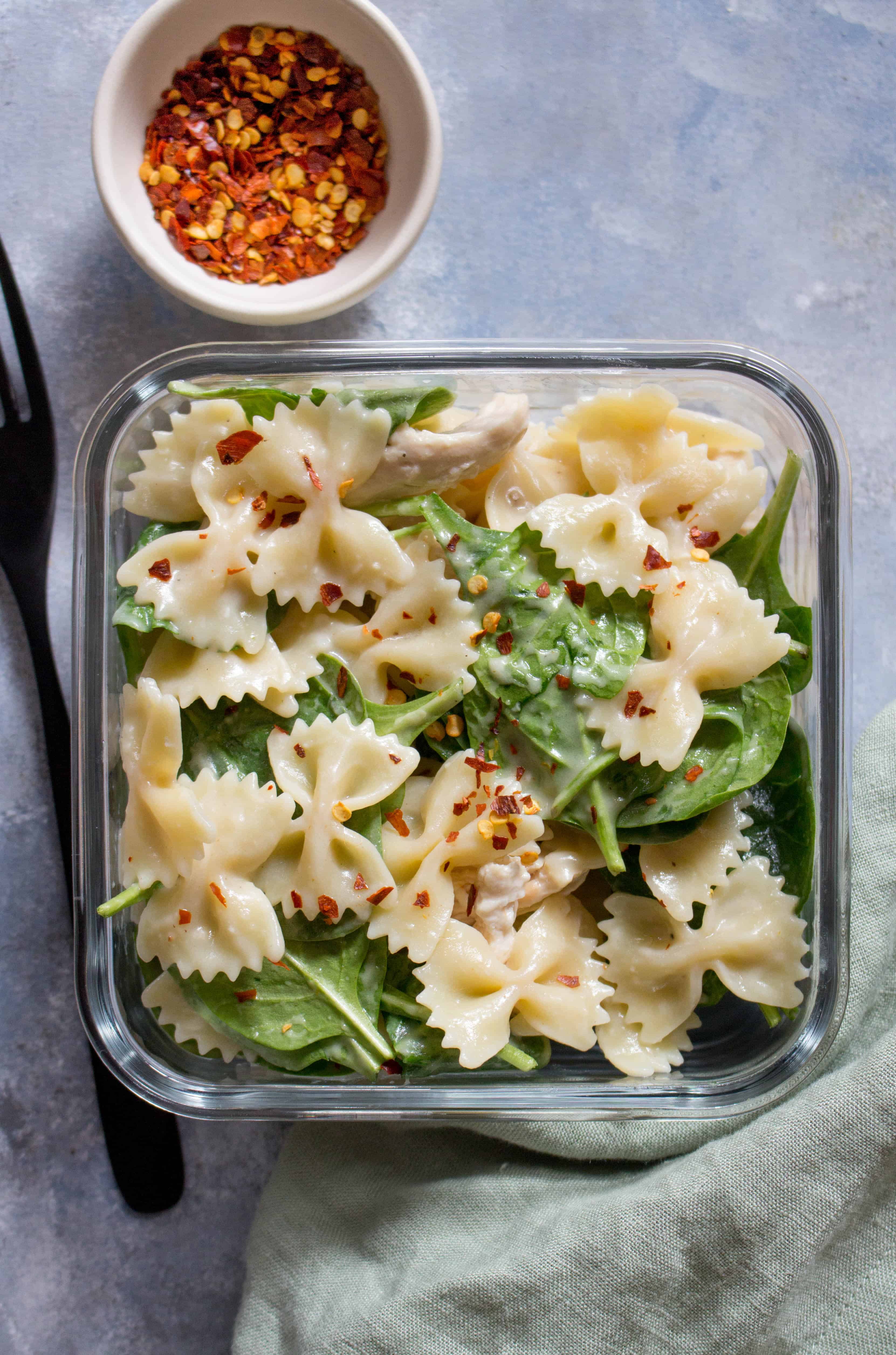 This Cold Chicken Spinach Pasta Salad is the perfect easy cold meal prep idea or a dish for a potluck!