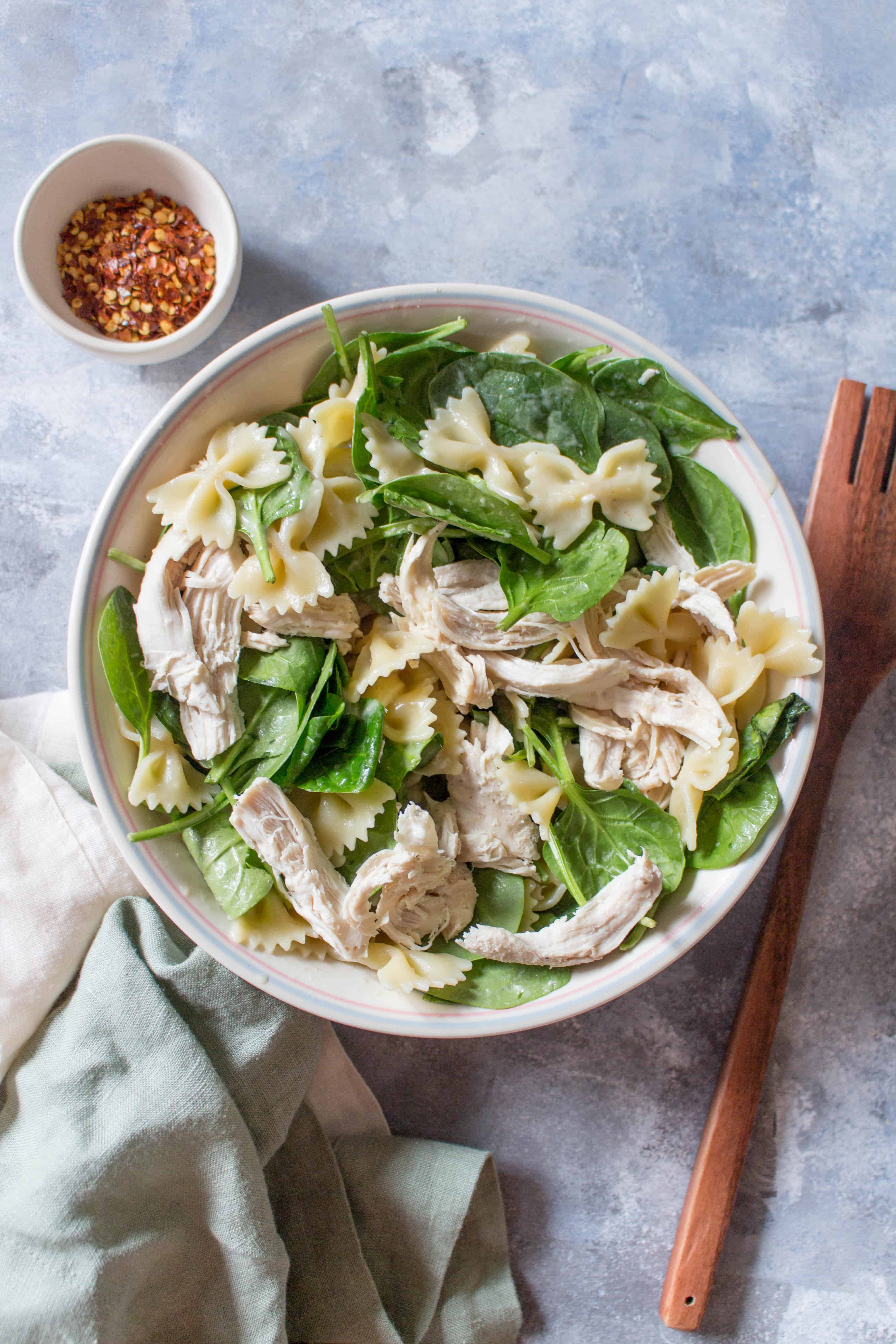 This Cold Chicken Spinach Pasta Salad is the perfect easy cold meal prep idea or a dish for a potluck!