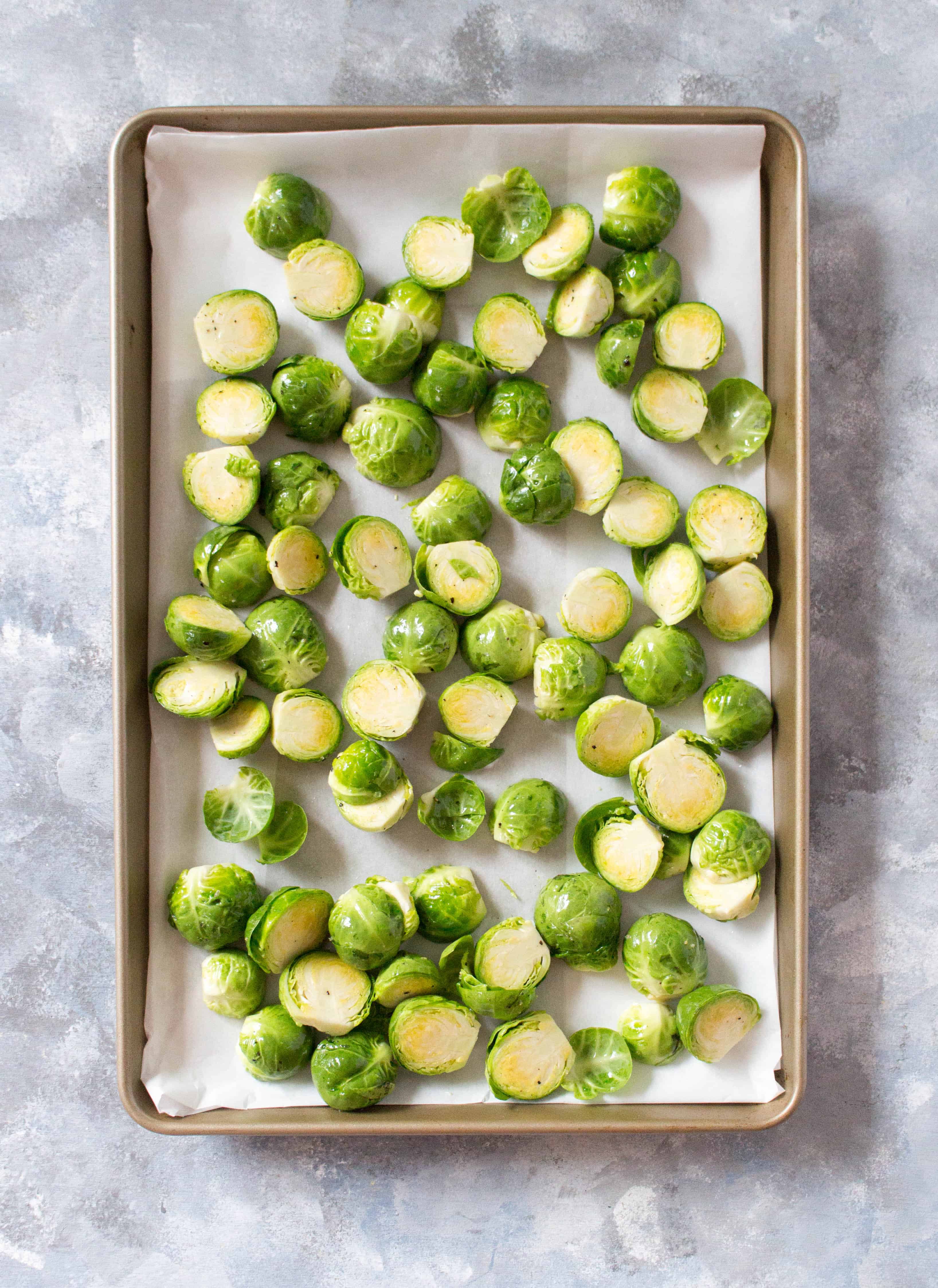 lemon parmesan brussel sprouts in a sheet pan for a holiday side dish