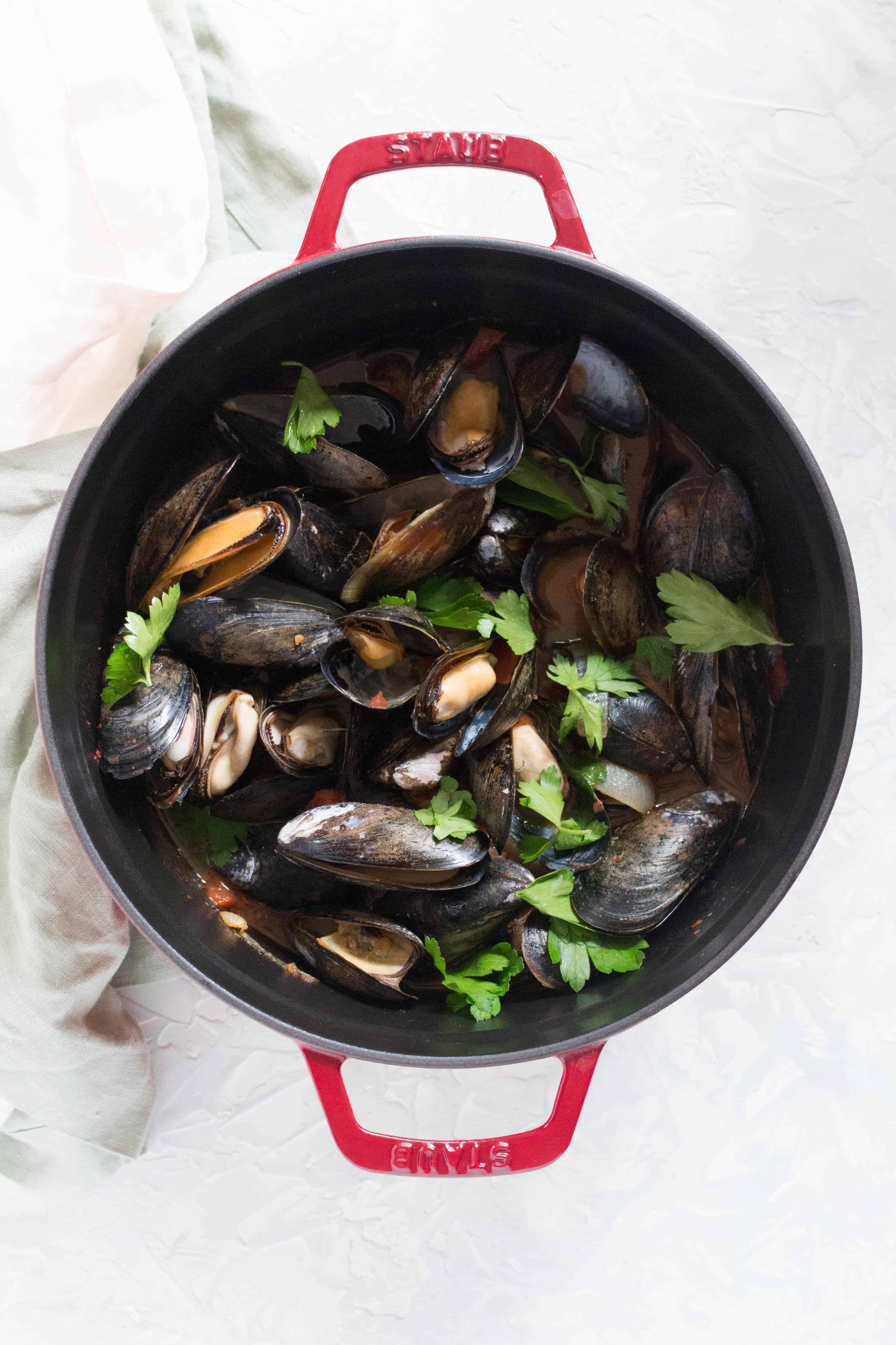 Looking for an easy recipe that looks impressive but takes little to no effort to put together? This Spicy Steamed Mussels is perfect!