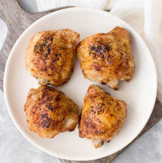 Curious as to how to make chicken thighs in your air fryer? Here is my basic air fryer chicken thighs recipe that takes 25 minutes to make!