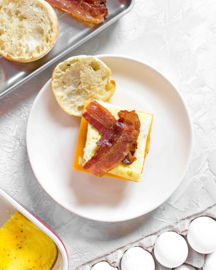 Skip the drive thru in the morning and make your own freezer friendly breakfast egg sandwiches. Make a batch, freeze it, and have a sandwich for breakfast everyday!