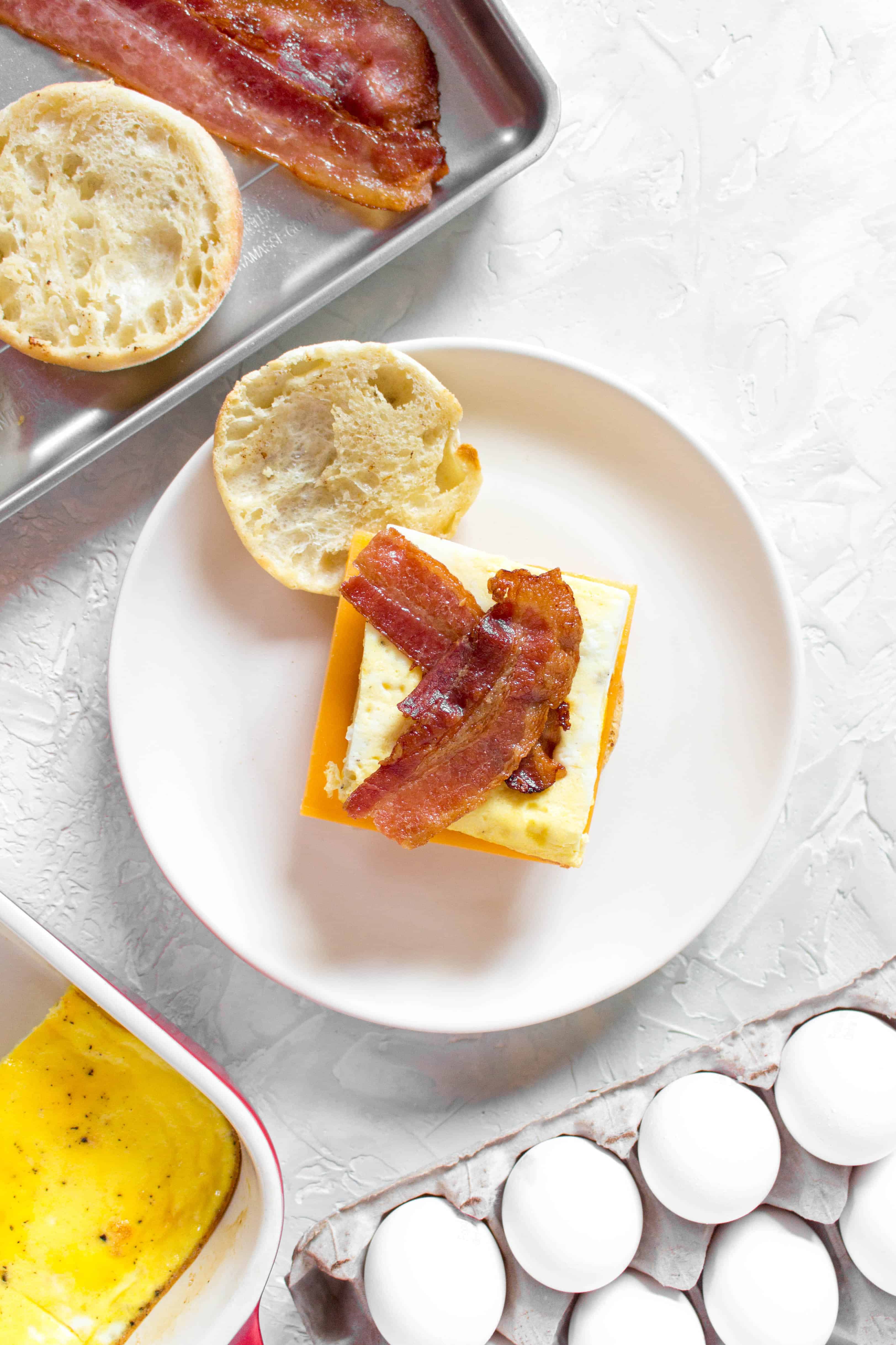 Skip the drive thru in the morning and make your own freezer friendly breakfast egg sandwiches. Make a batch, freeze it, and have a sandwich for breakfast everyday!