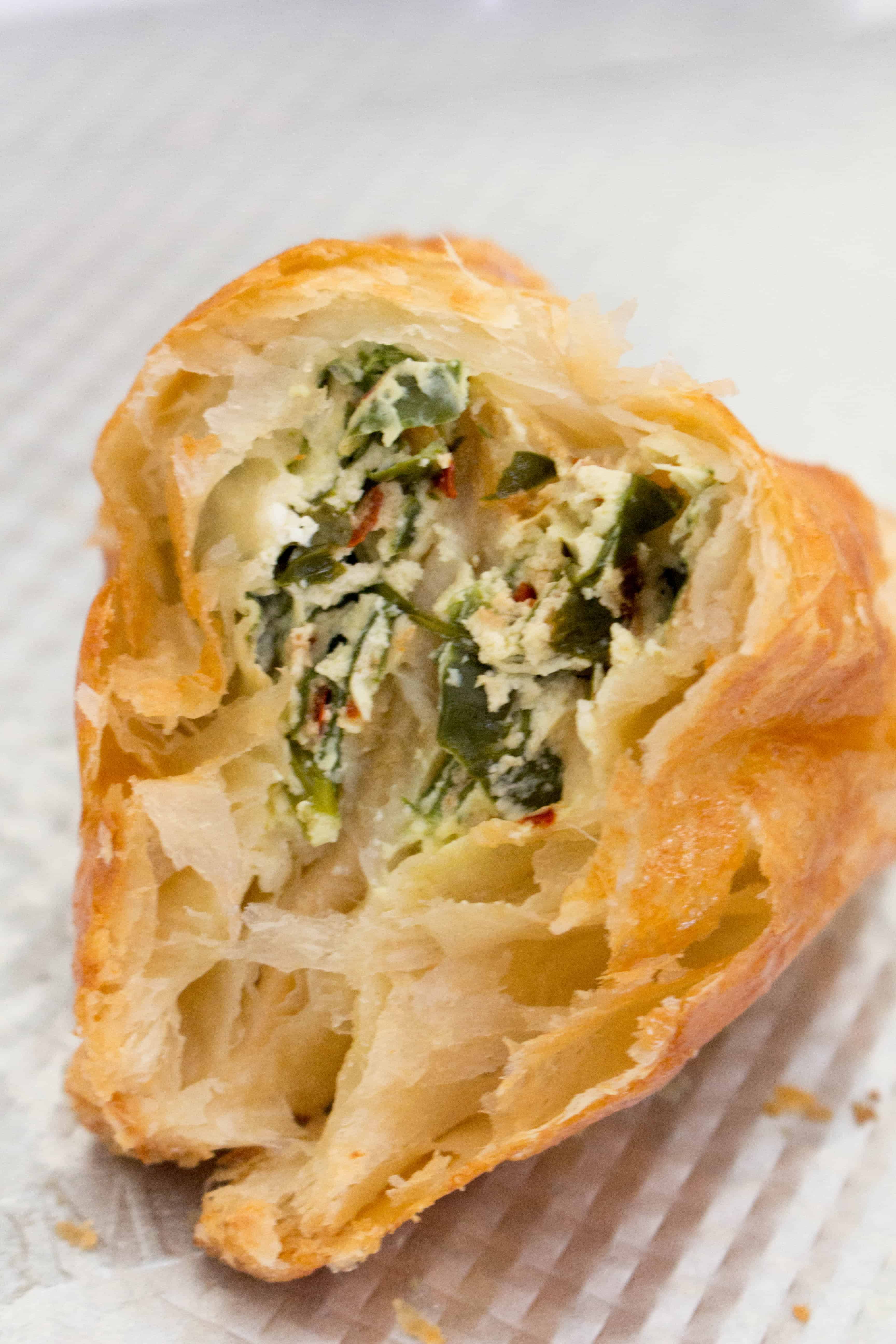 inside of a savoury spinach and cheese hand pie