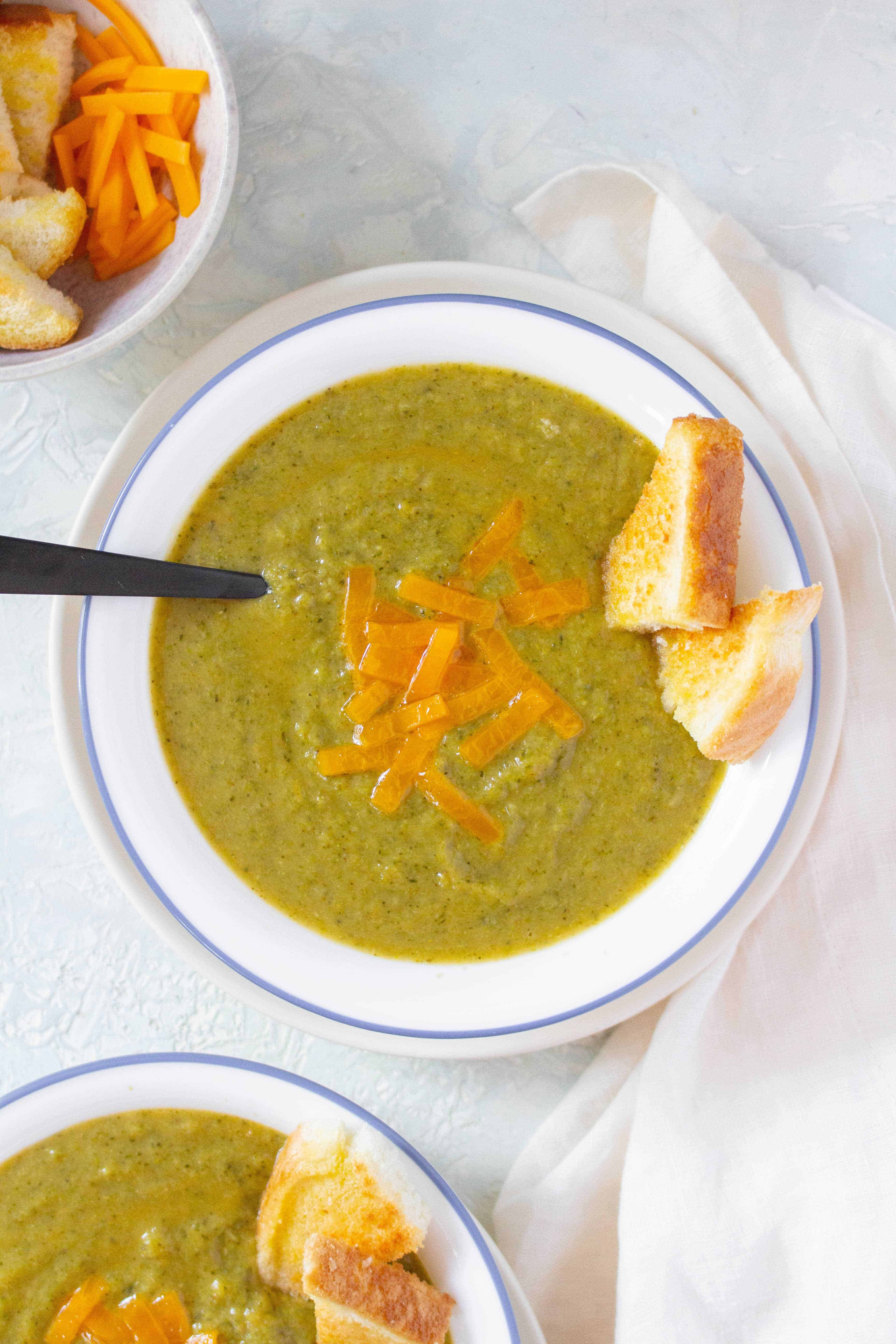 Craving some soup? Try this Instant Pot Broccolini Broccoli Cheddar Soup that takes under 15 minutes to make!