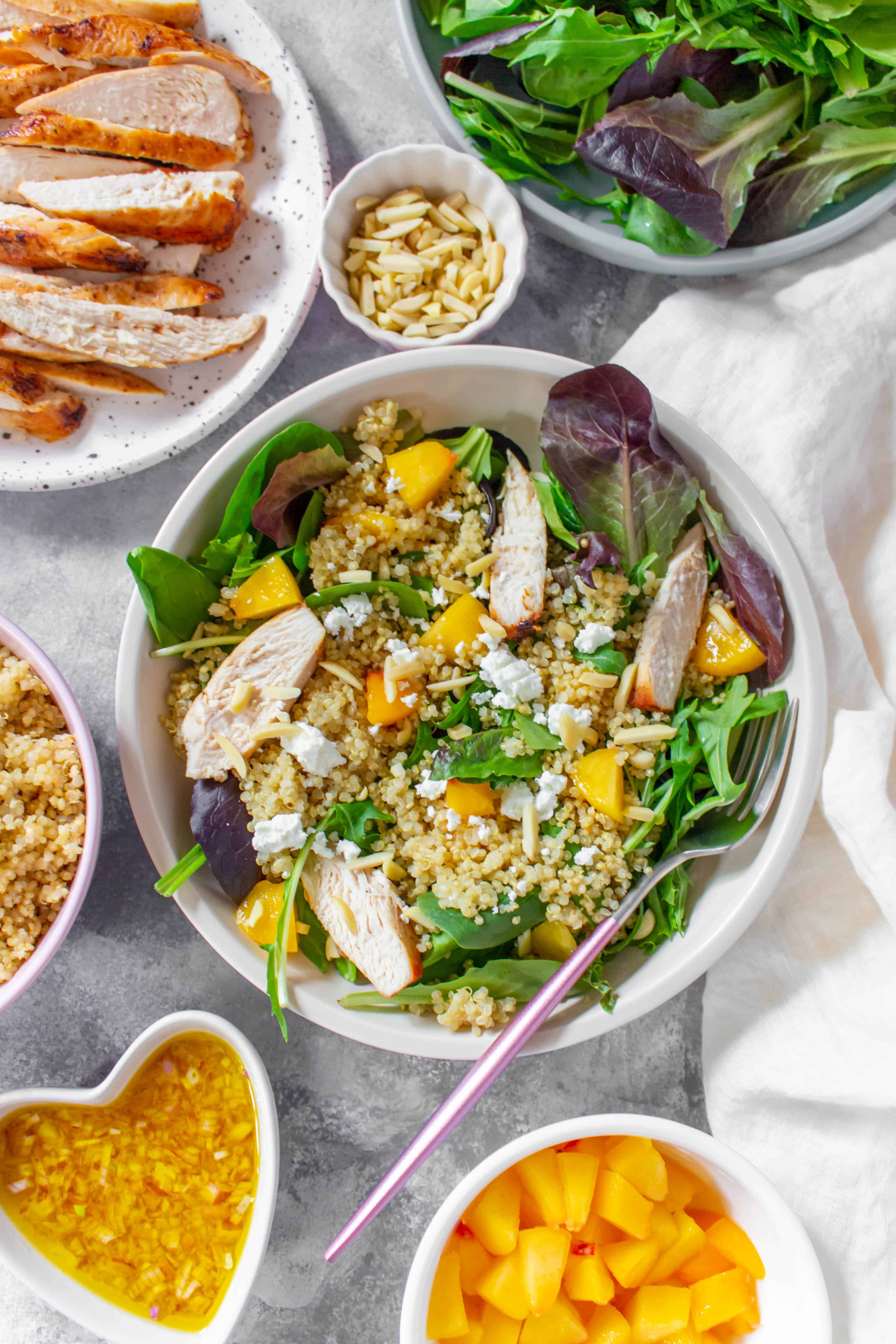 This Peach Quinoa Salad is the perfect cold lunch meal prep as well as being super easy to make for a large gathering! Look no further for a cold lunch idea than this sweet peachy salad.