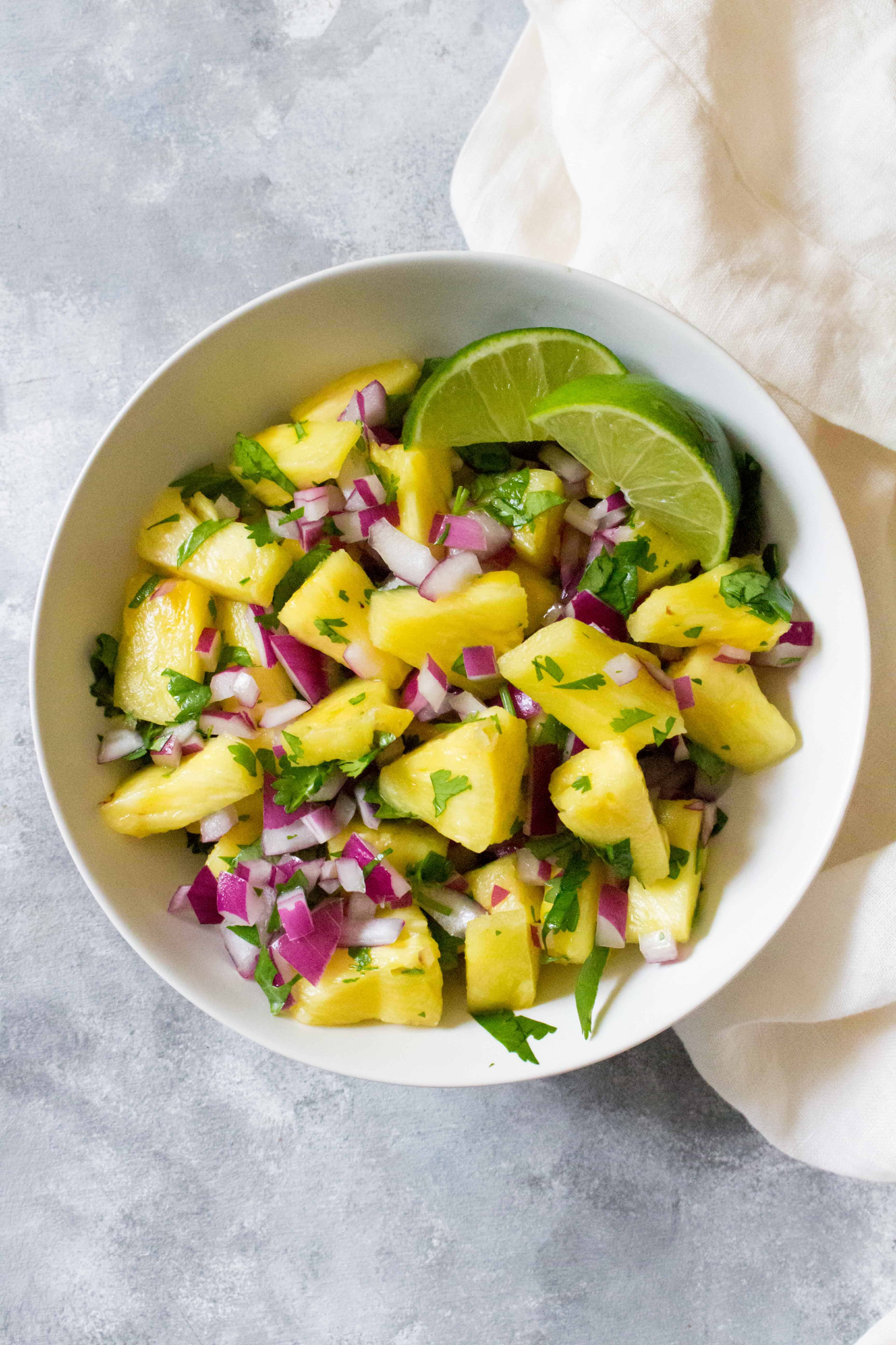 This easy peasy no fuss pineapple salsa barely takes any time to put together! Perfect as a side dish and great for potlucks!