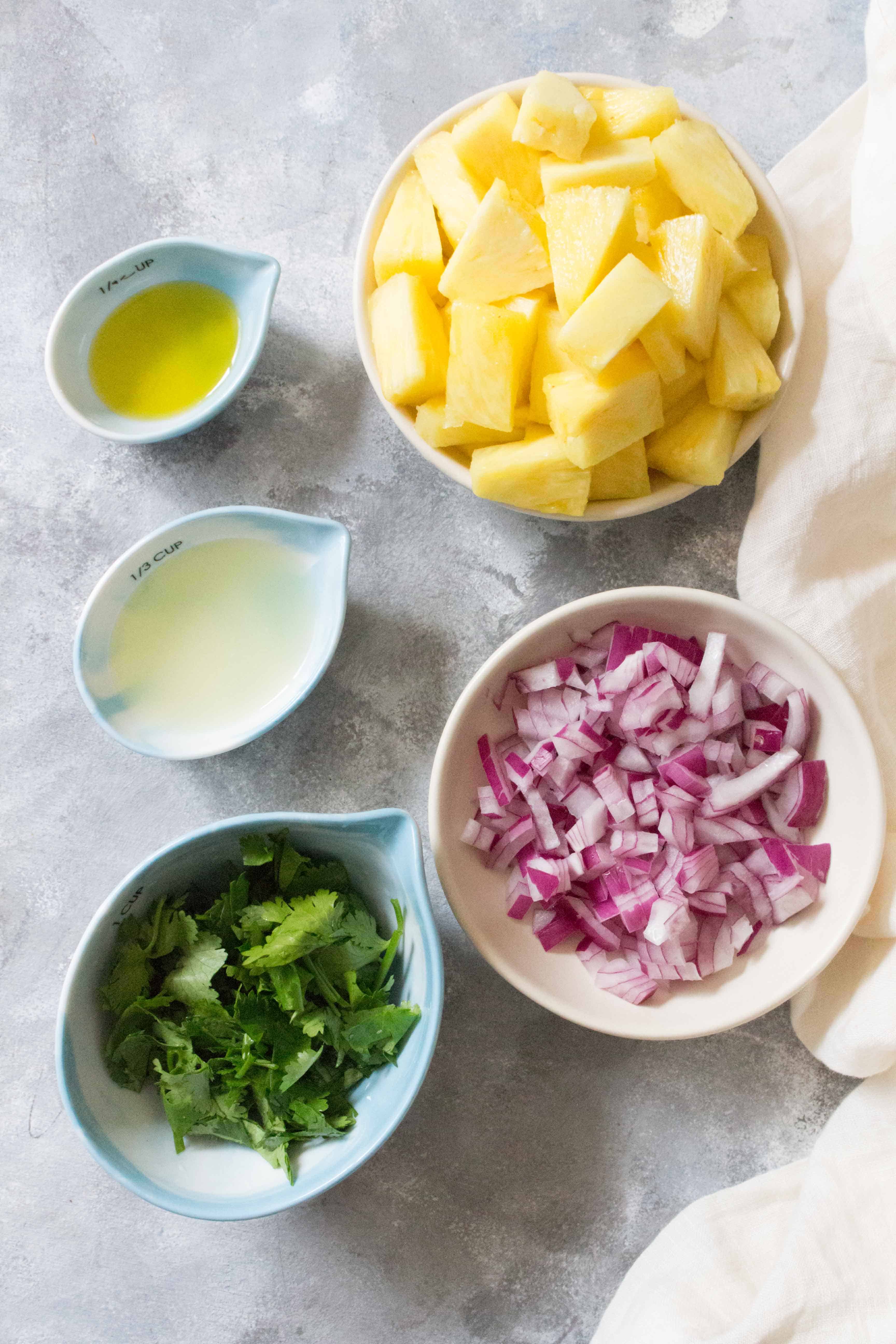 This easy peasy no fuss pineapple salsa barely takes any time to put together! Perfect as a side dish and great for potlucks!