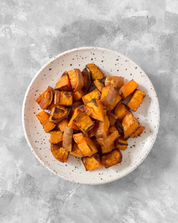 Easy to make and goes great in meal preps, salads, or as a side dish, this is how I make my simple Roasted Sweet Potato Cubes!