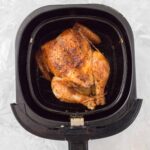 Got an air fryer and want a juicy and tender roast chicken? Perfectly moist with crispy skin, make this whole chicken in an air fryer in under 30 minutes. 