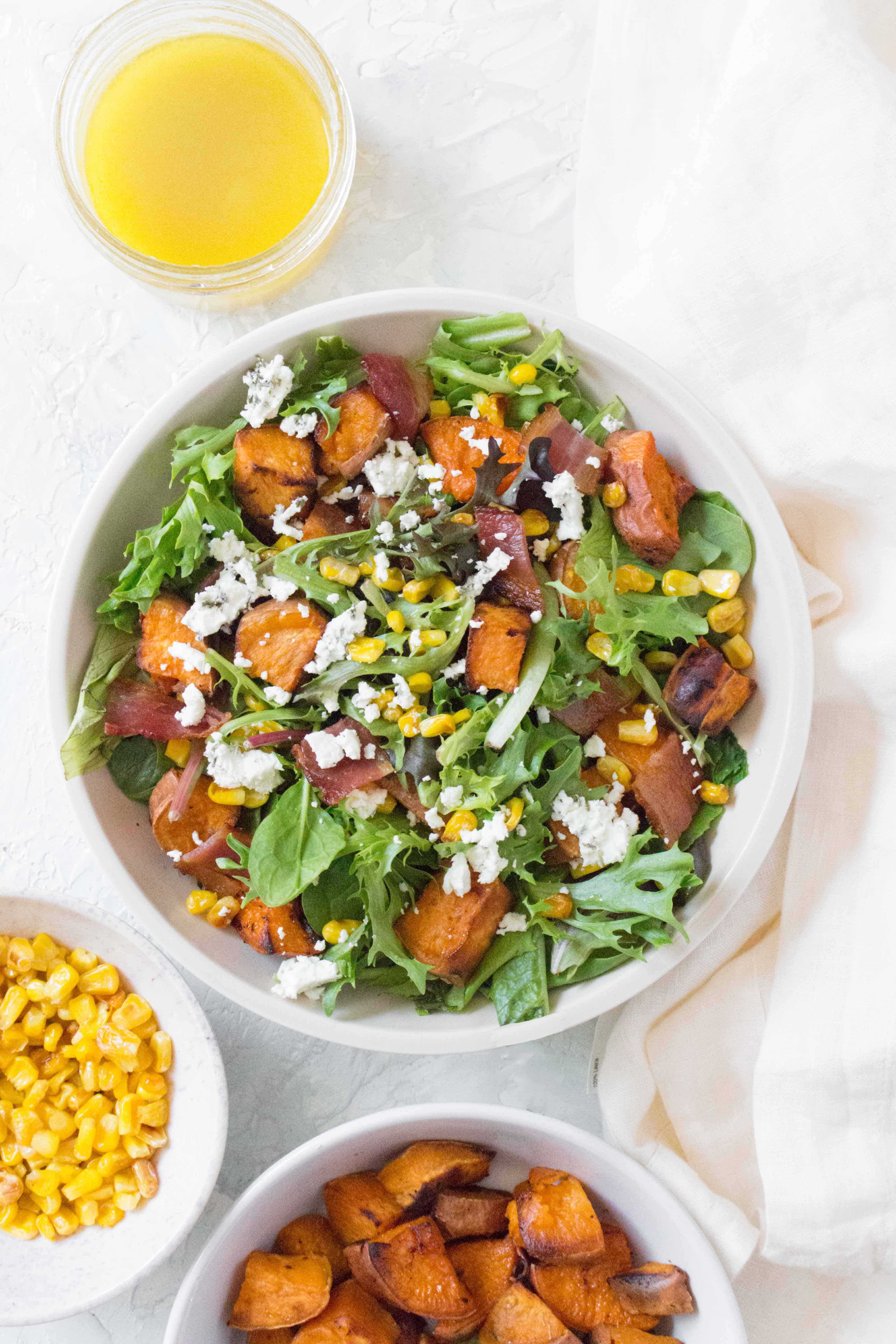 This Roasted Sweet Potato Salad with Corn and Bacon is the perfect salad for your meal prep or dinner party!