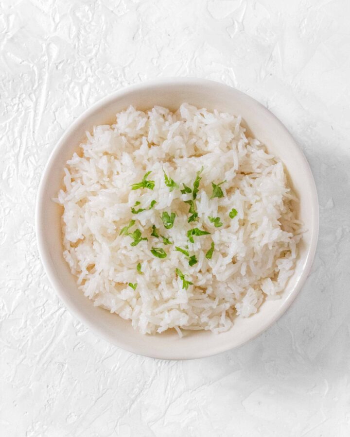 This easy Coconut Rice is the perfect side dish! Make it in a couple of minutes on the stovetop with only a couple simple ingredients!