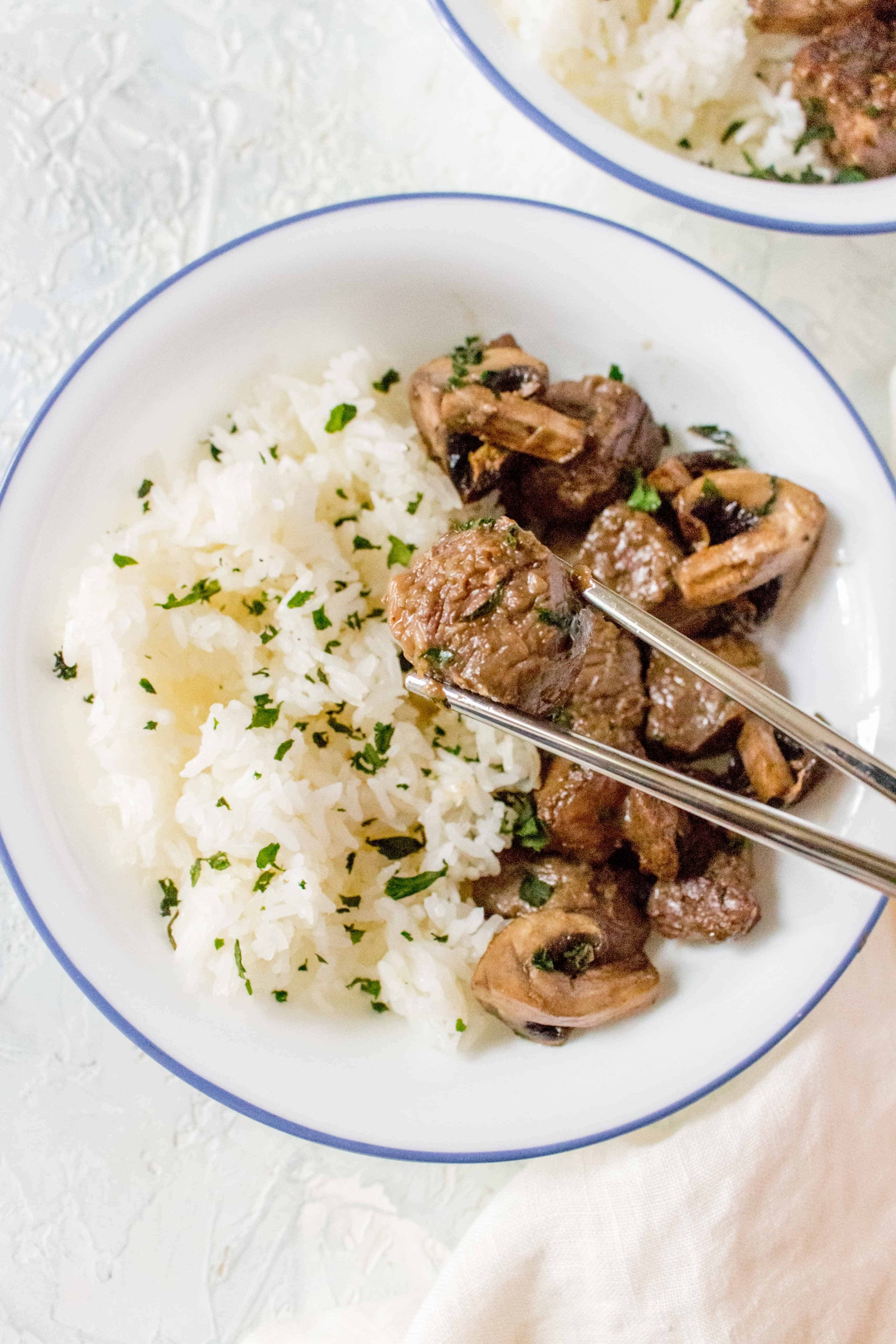 This Air Fryer Steak Bites and Mushroom recipe with a soy garlic marinade makes for the perfect quick different or as a meal prep for the week!