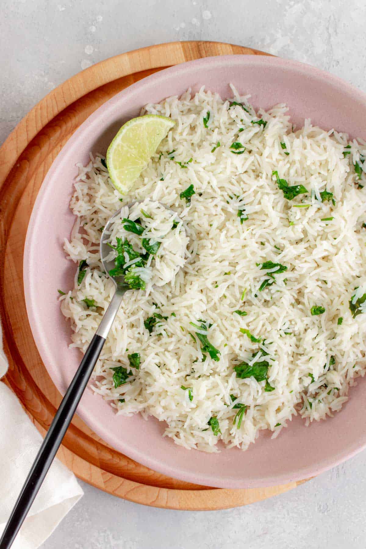 a bowl of instant pot coconut lime rice with a spoon.