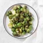 Crispy on the outside, and perfectly tender on the inside, these air fryer Brussels sprouts are going to be a hit! Here's how to make Crispy Air Fryer Brussels Sprouts!