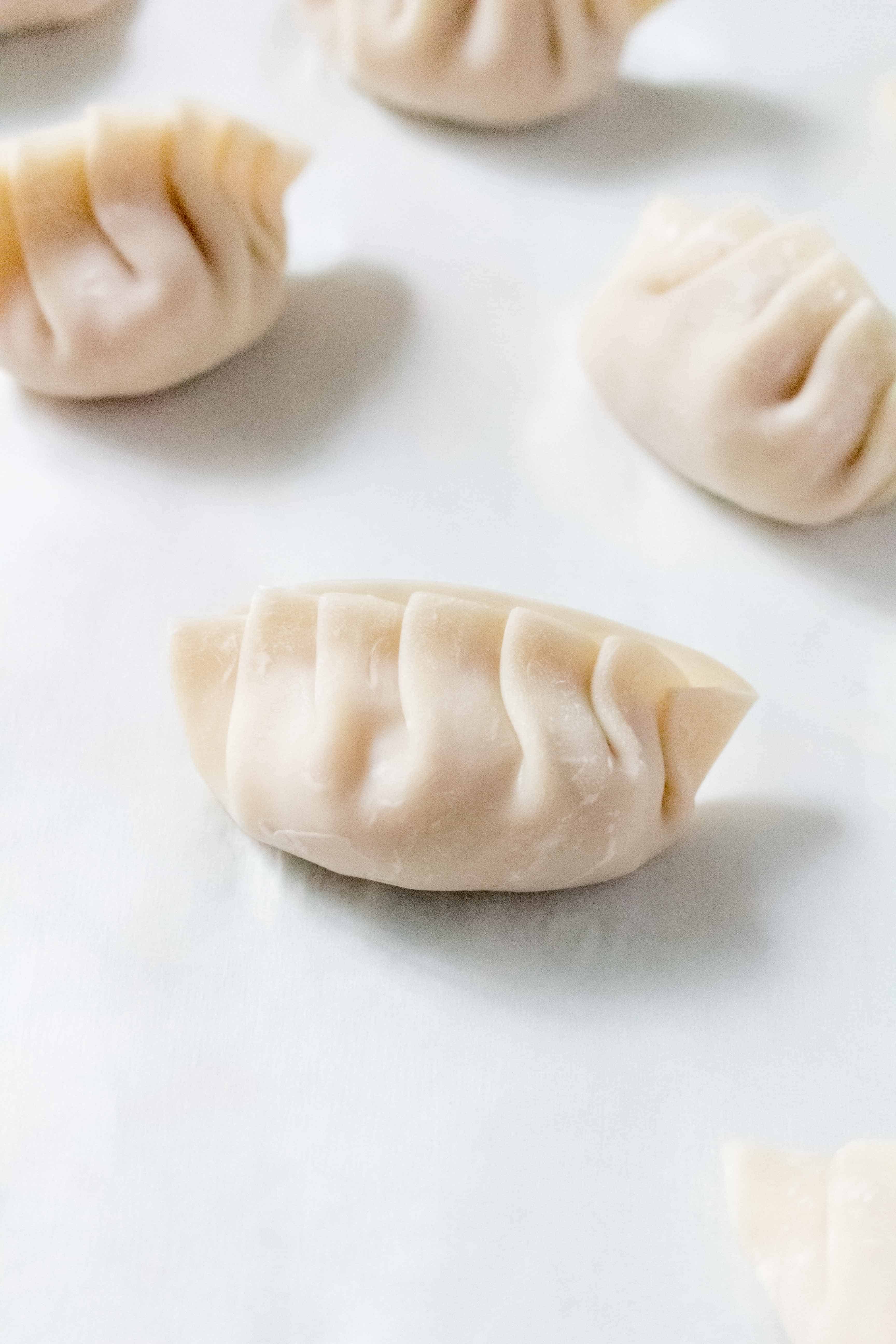 Filled with pork and garlic and have crispy golden bottoms, Pork Potstickers makes for the perfect meal or meal prep. These potstickers are freezer friendly so you can make always have some on hand!