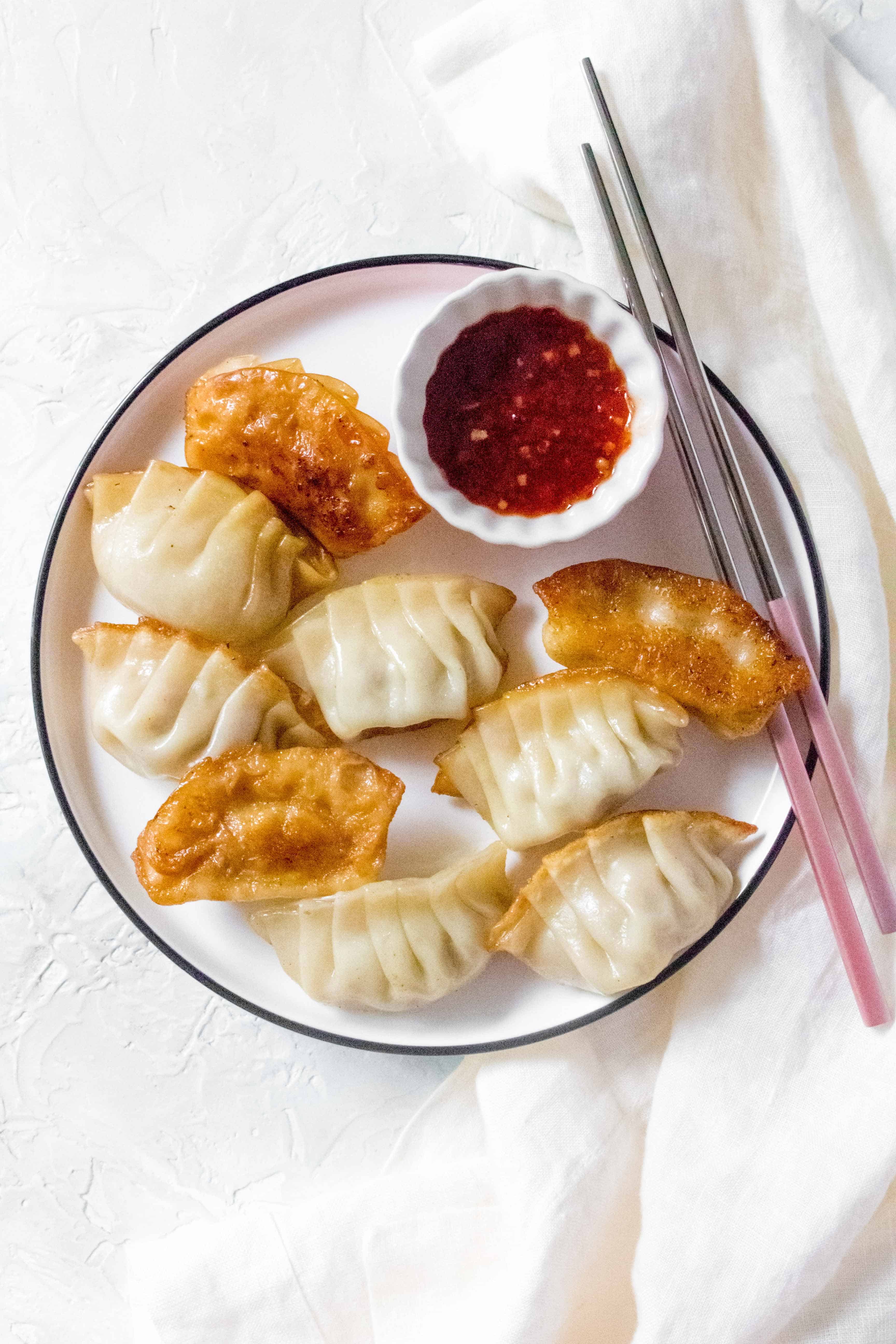 Filled with pork and garlic and have crispy golden bottoms, Pork Potstickers makes for the perfect meal or meal prep. These potstickers are freezer friendly so you can make always have some on hand!