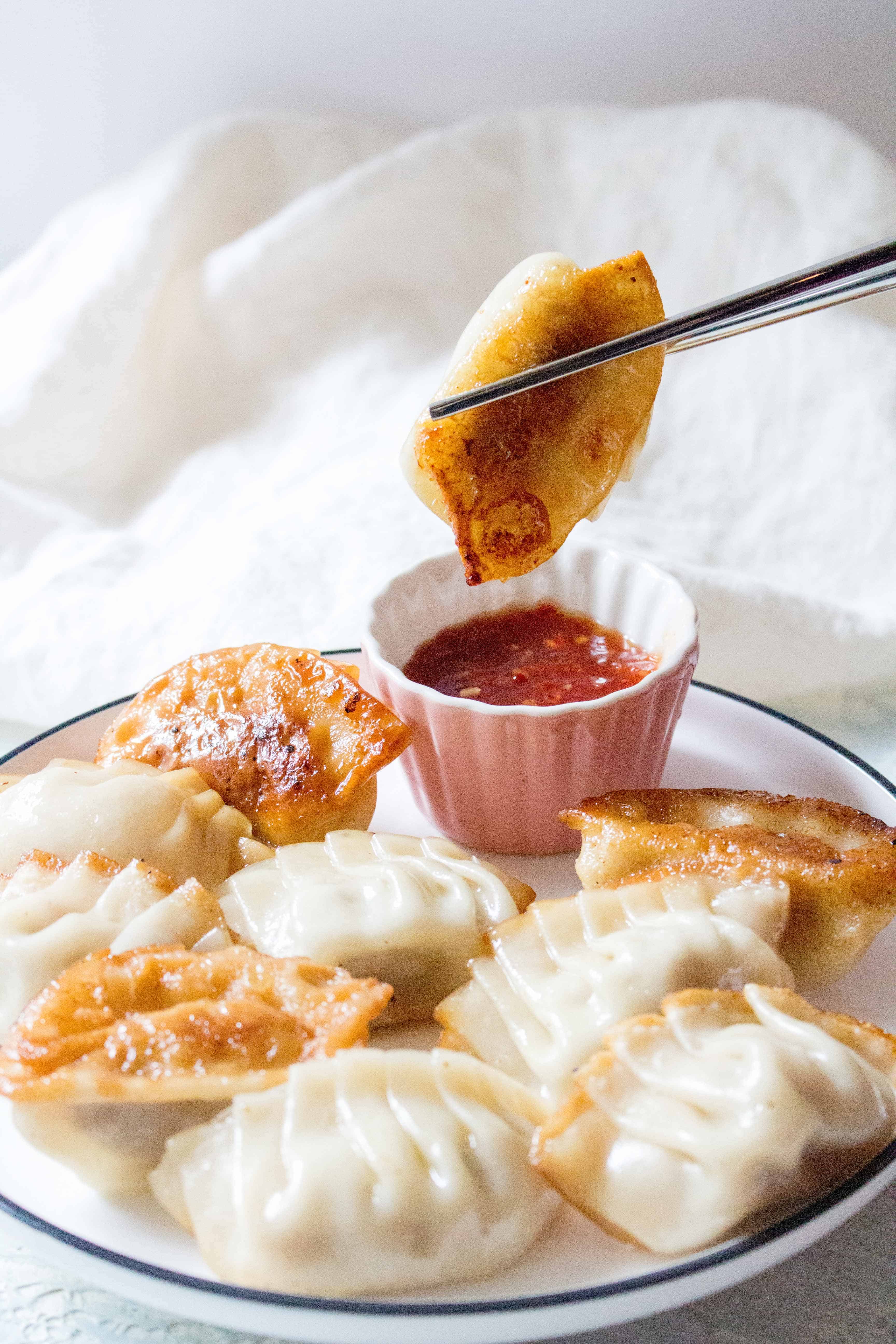 Filled with pork and garlic and have crispy golden bottoms, Pork Potstickers makes for the perfect meal or meal prep. These potstickers are freezer friendly so you can make always have some on hand!