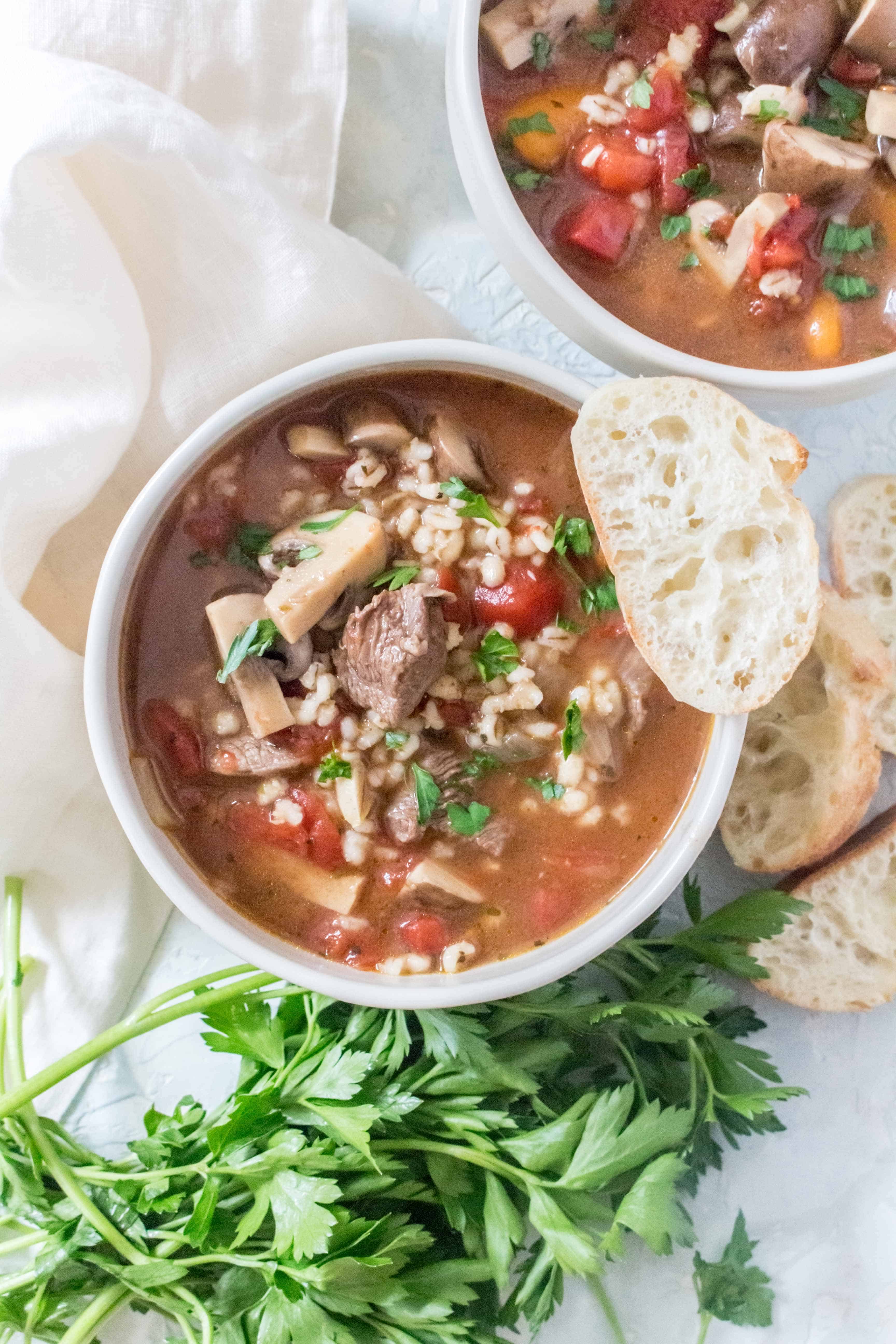 Super rich, freezer friendly, and delicious, this Instant Pot Beef and Barley Soup is comfort in a bowl!