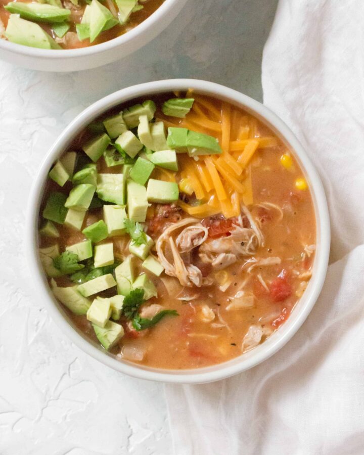Instant Pot Chicken Chili | Slow Cooker Chicken Chili topped with avocado and cheese