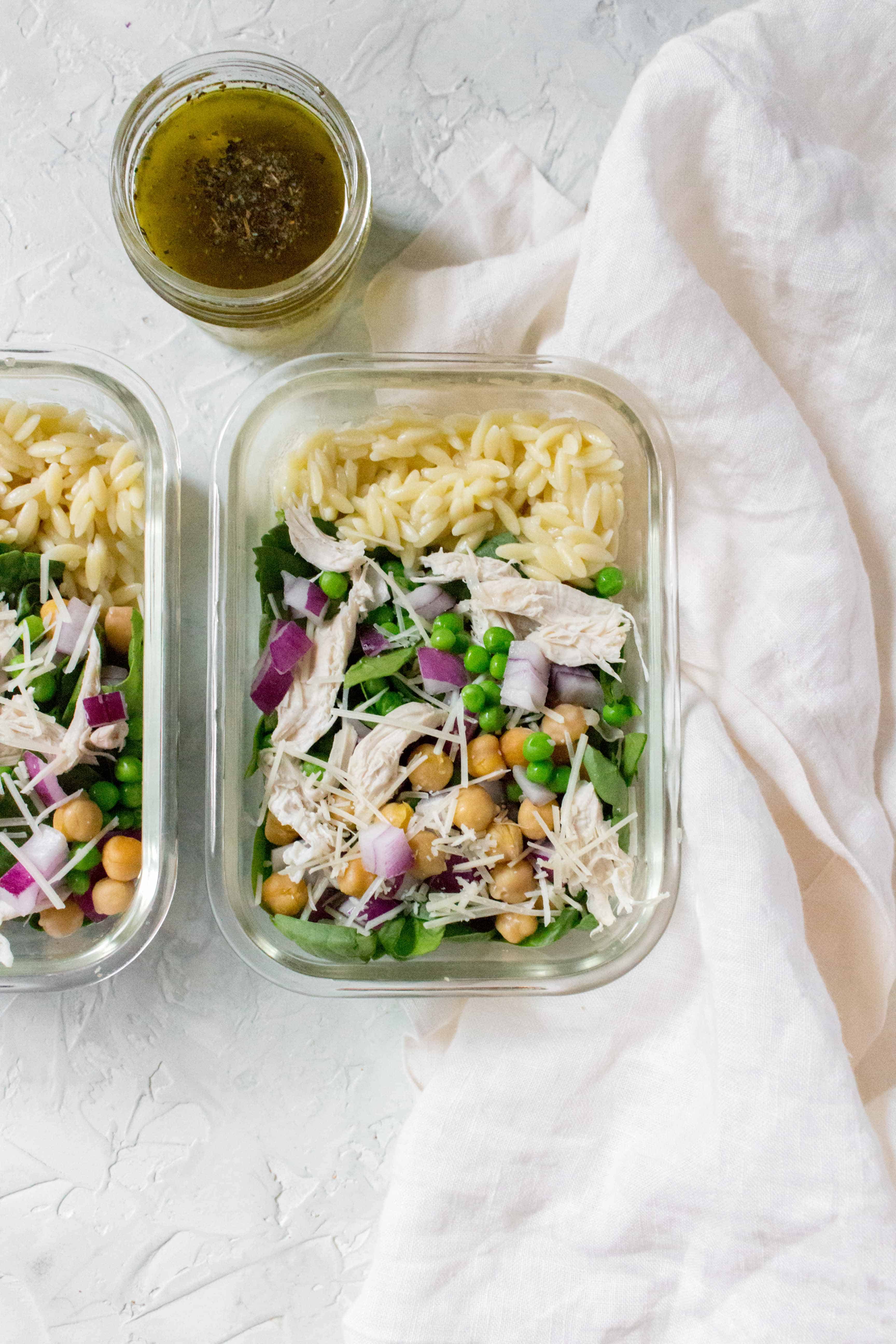 Salads don't have to be boring! Here's a delicious and hearty Orzo Salad Meal Prep for you to try this week! This orzo meal prep is the perfect cold work lunch as its filling and packed with healthy goodness! No boring iceberg lettuce here.