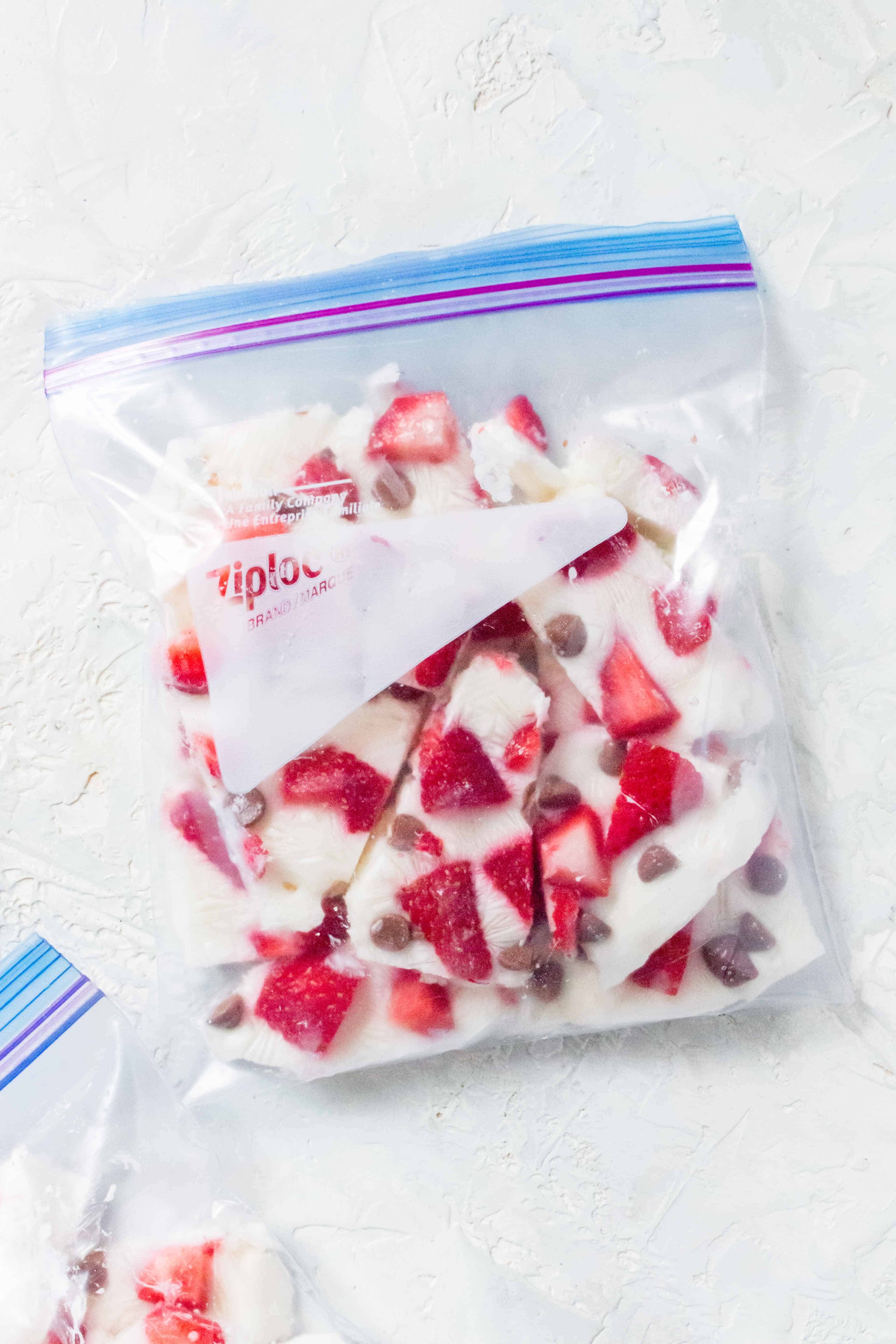 This Frozen Yogurt Bark with Strawberries and Chocolate Chips is the perfect make ahead snack! Healthy, fun to eat, and easy to make! 