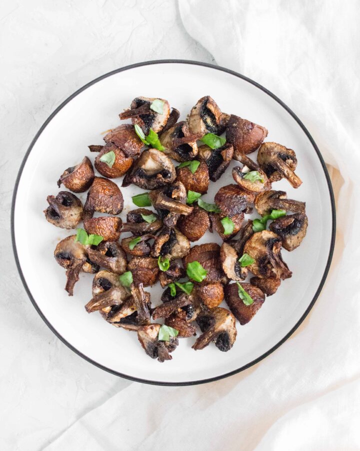 mushrooms made from an air fryer on a plate with garnish