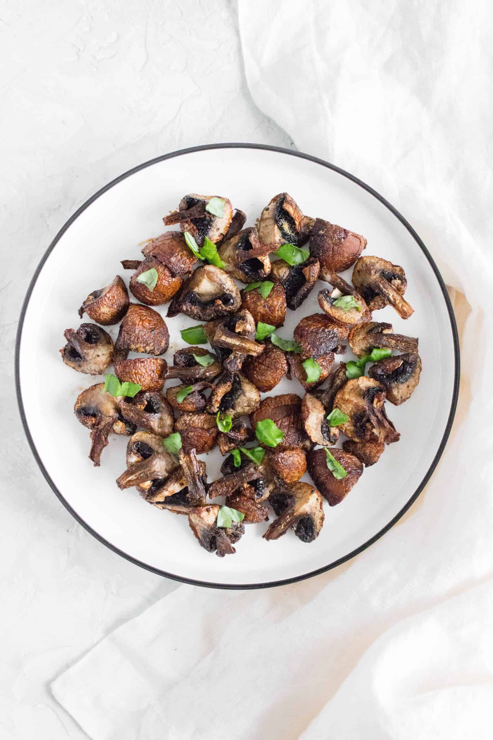 mushrooms made from an air fryer on a plate with garnish