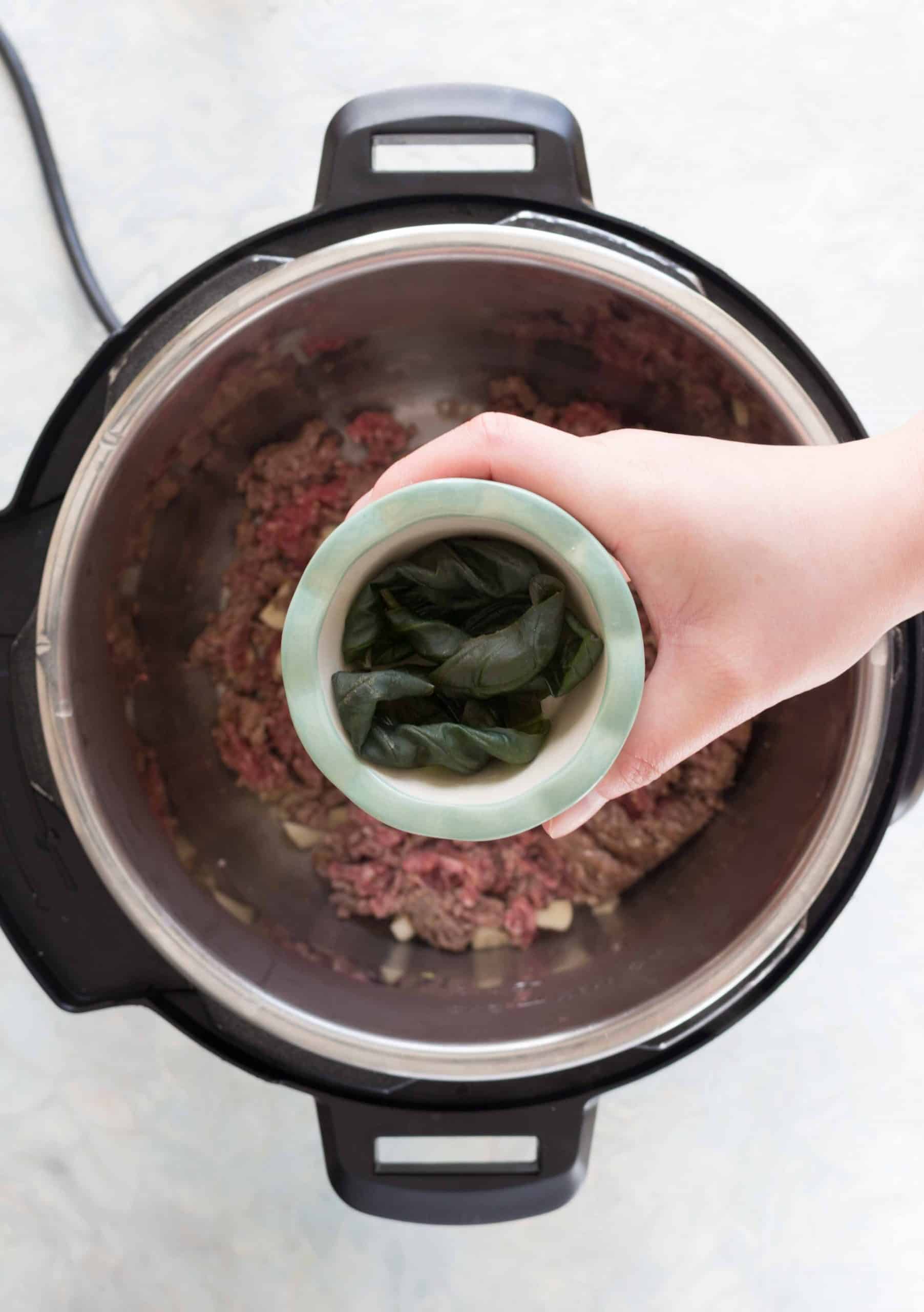 adding basil into beef for beef browning in instant pot for instant pot spaghetti 