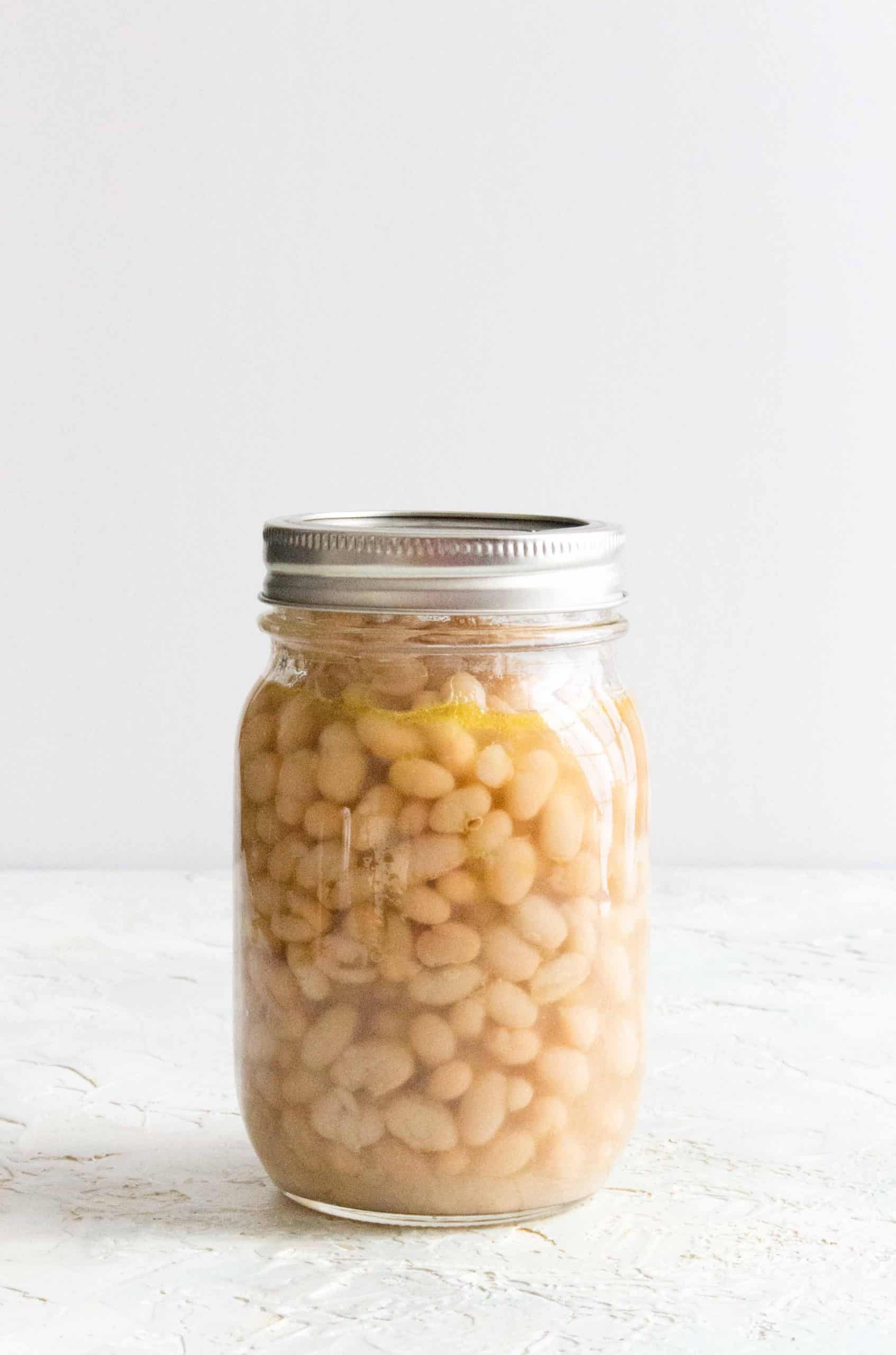 pressure cooked navy beans stored in a mason jar