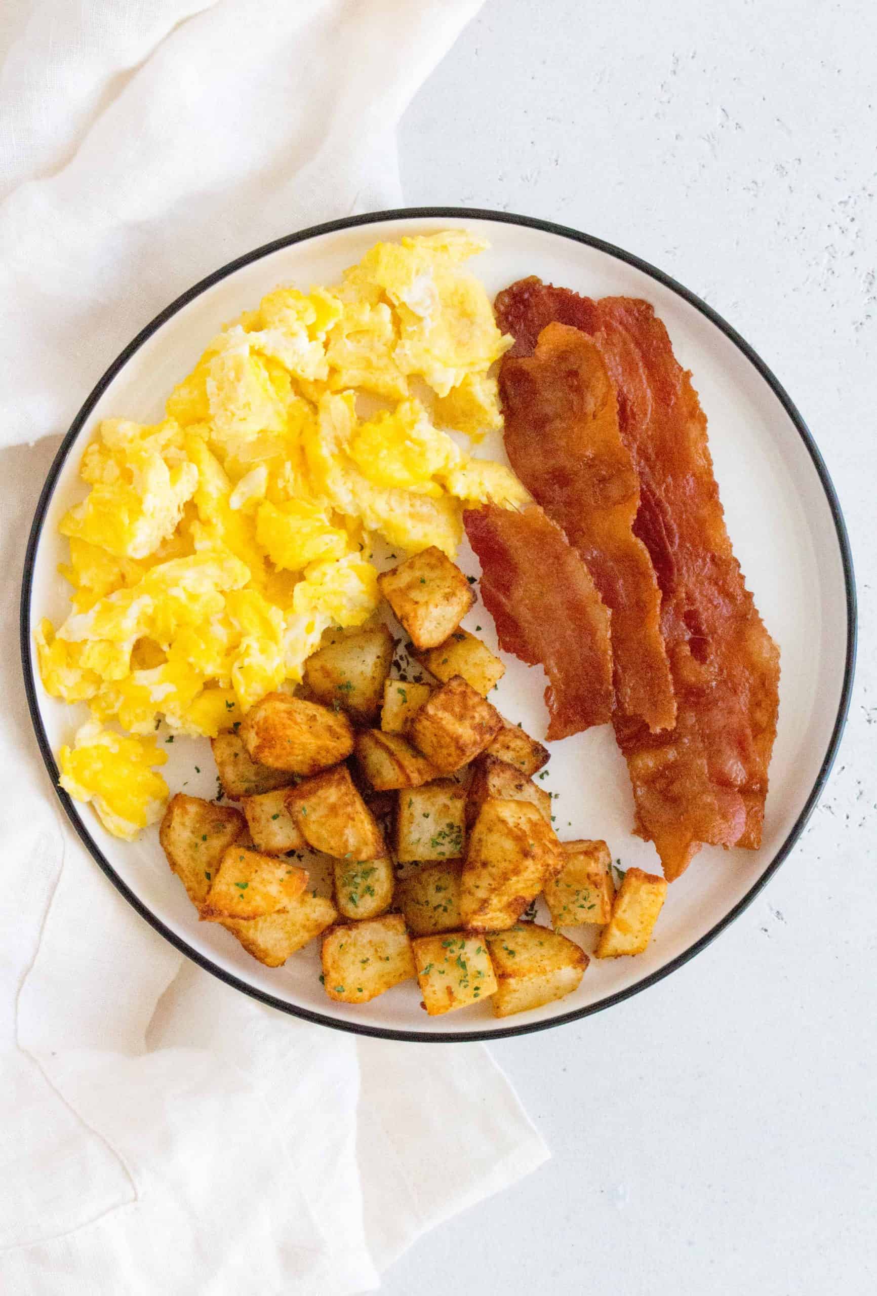 air fryer breakfast potatoes with scrambled eggs and bacon